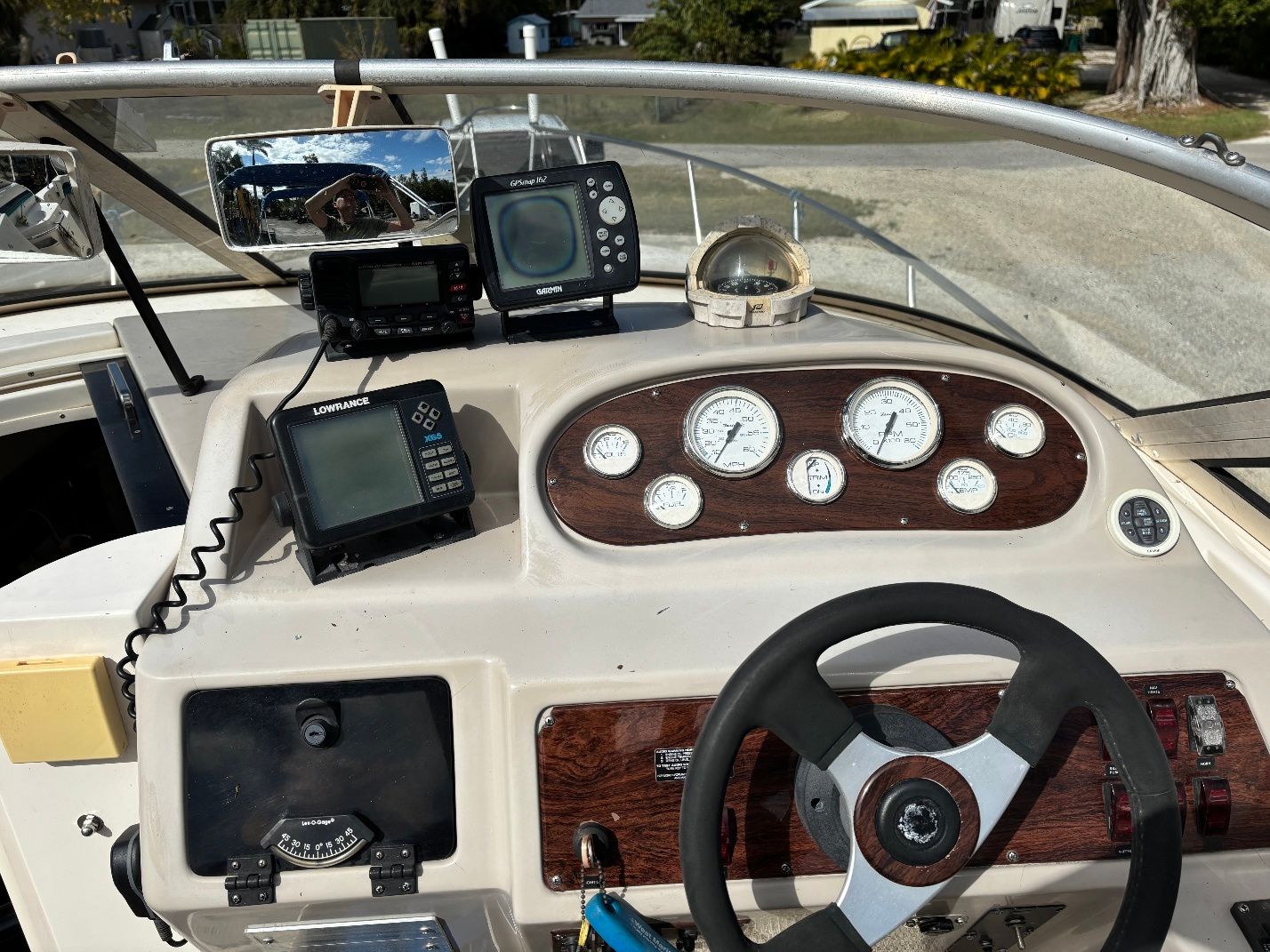 Dashboard of a 1997 Donzi 275LXC boat with navigation equipment.