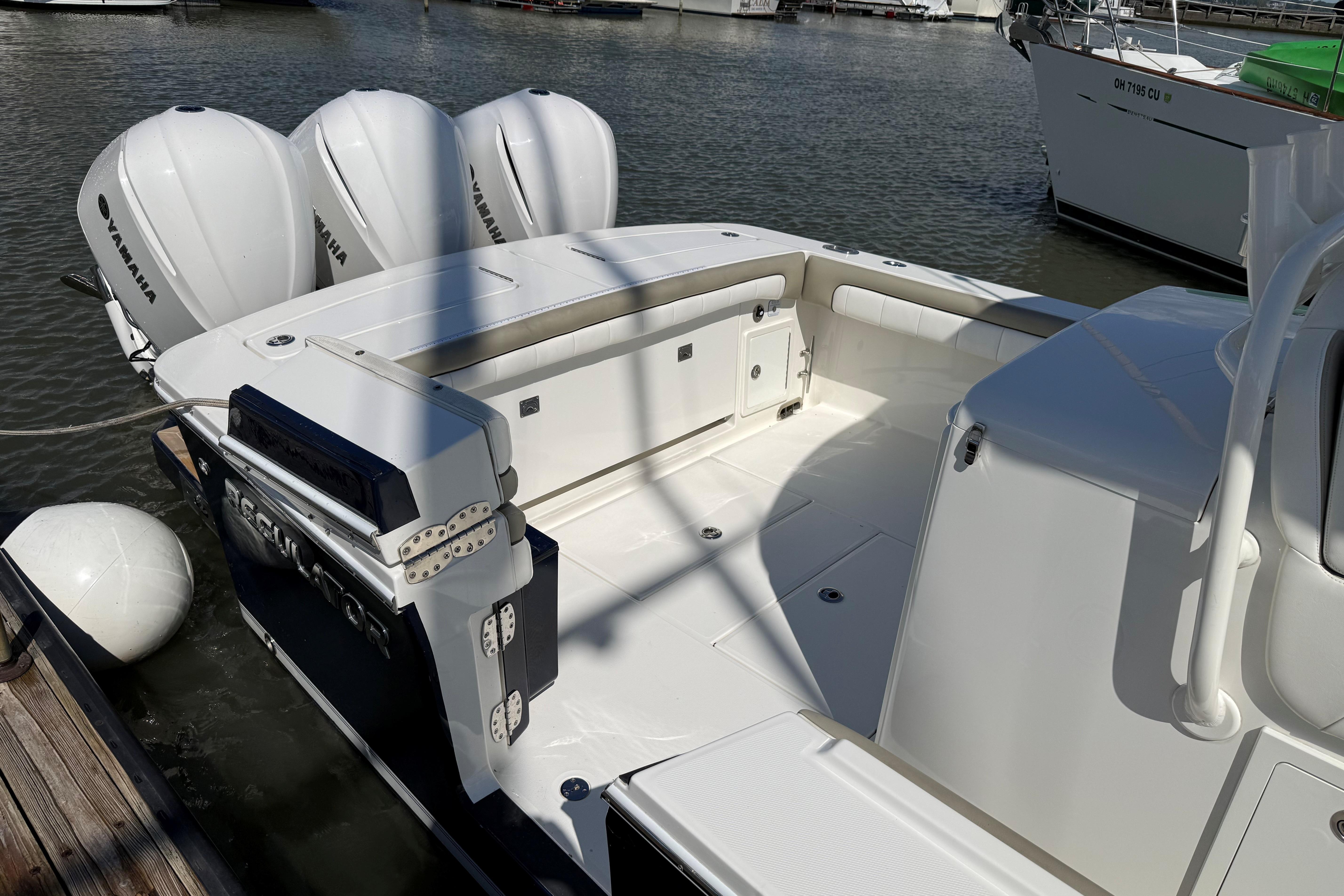 2019 Regulator 34SS boat with Yamaha engines docked at marina.