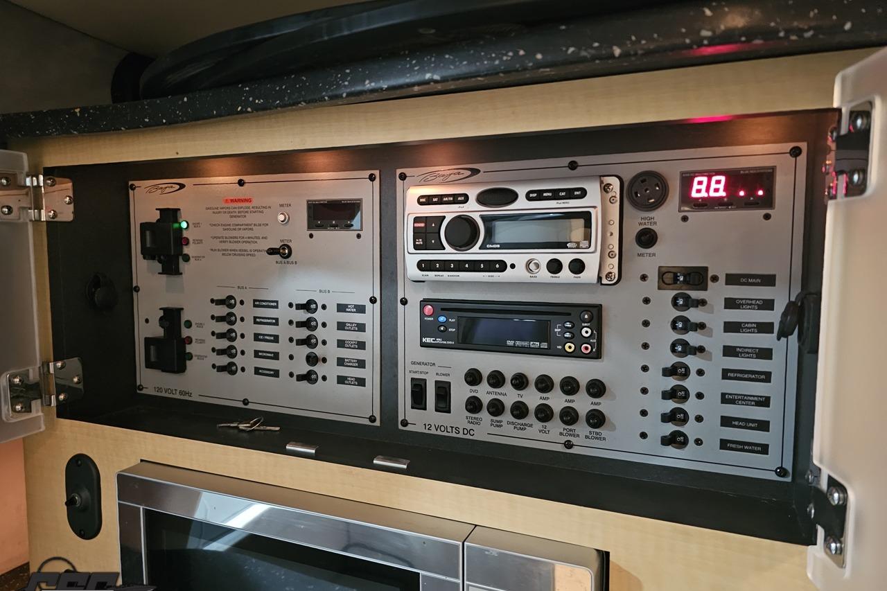 Control panel of a 2008 Baja 335 Performance boat with various switches and displays.