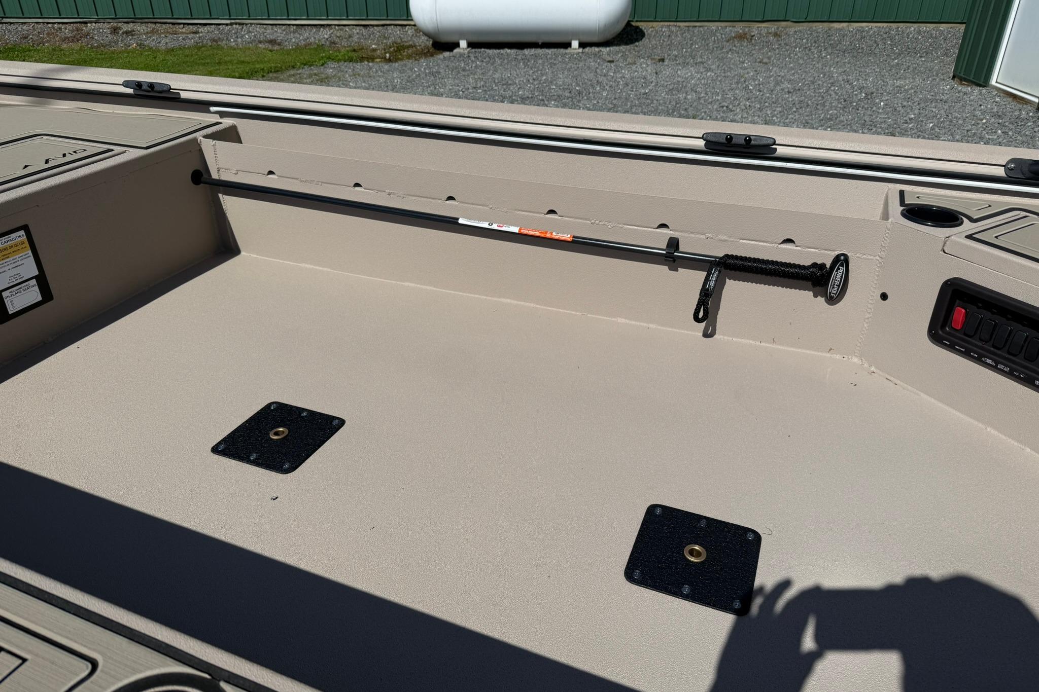 Interior of 2026 Avid 16 Commander boat showing storage and seating area.