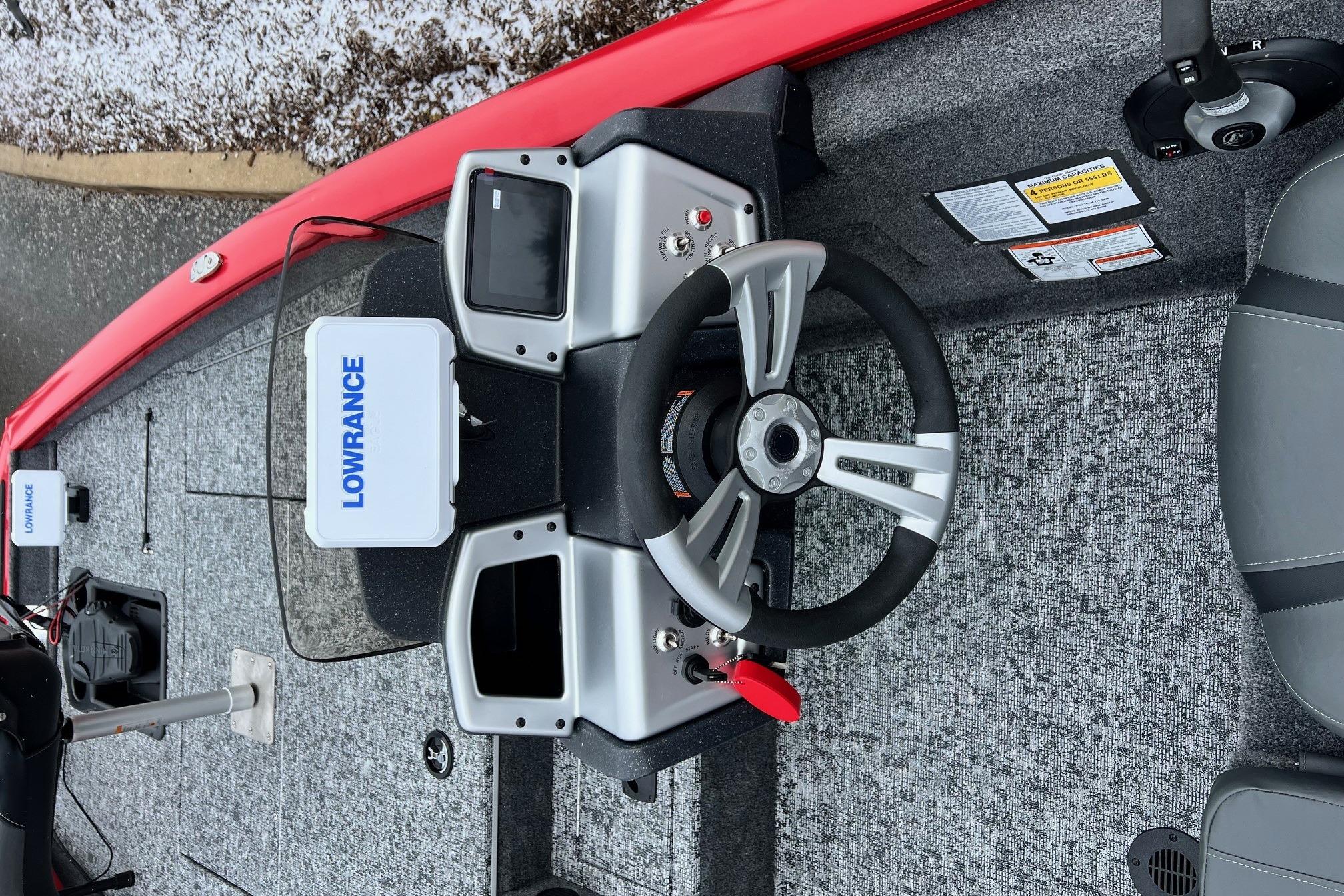 2026 Tracker Pro Team 175 boat dashboard with Lowrance electronics and steering wheel.
