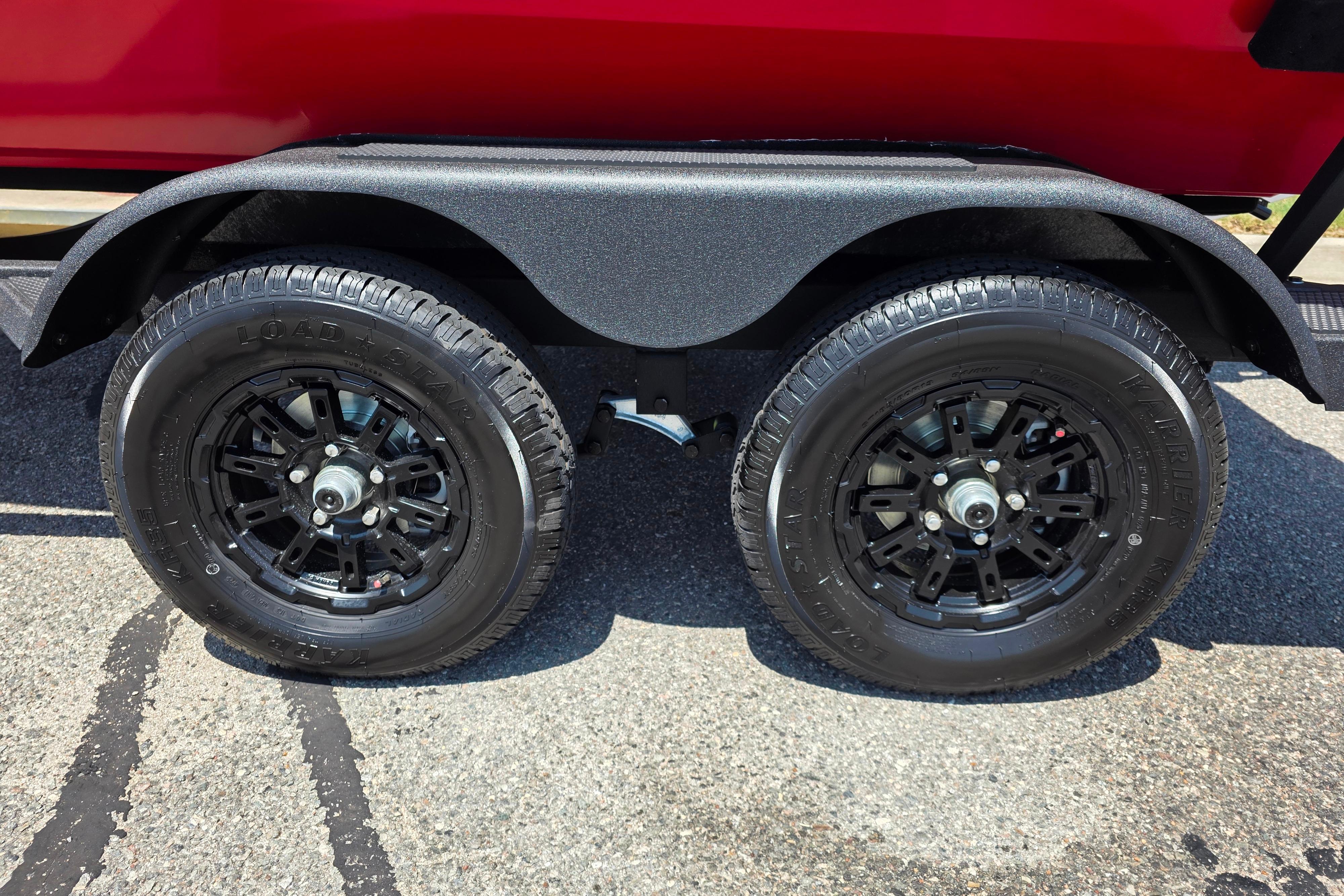 Dual black wheels on a 2026 Tracker Pro Team 195 trailer.