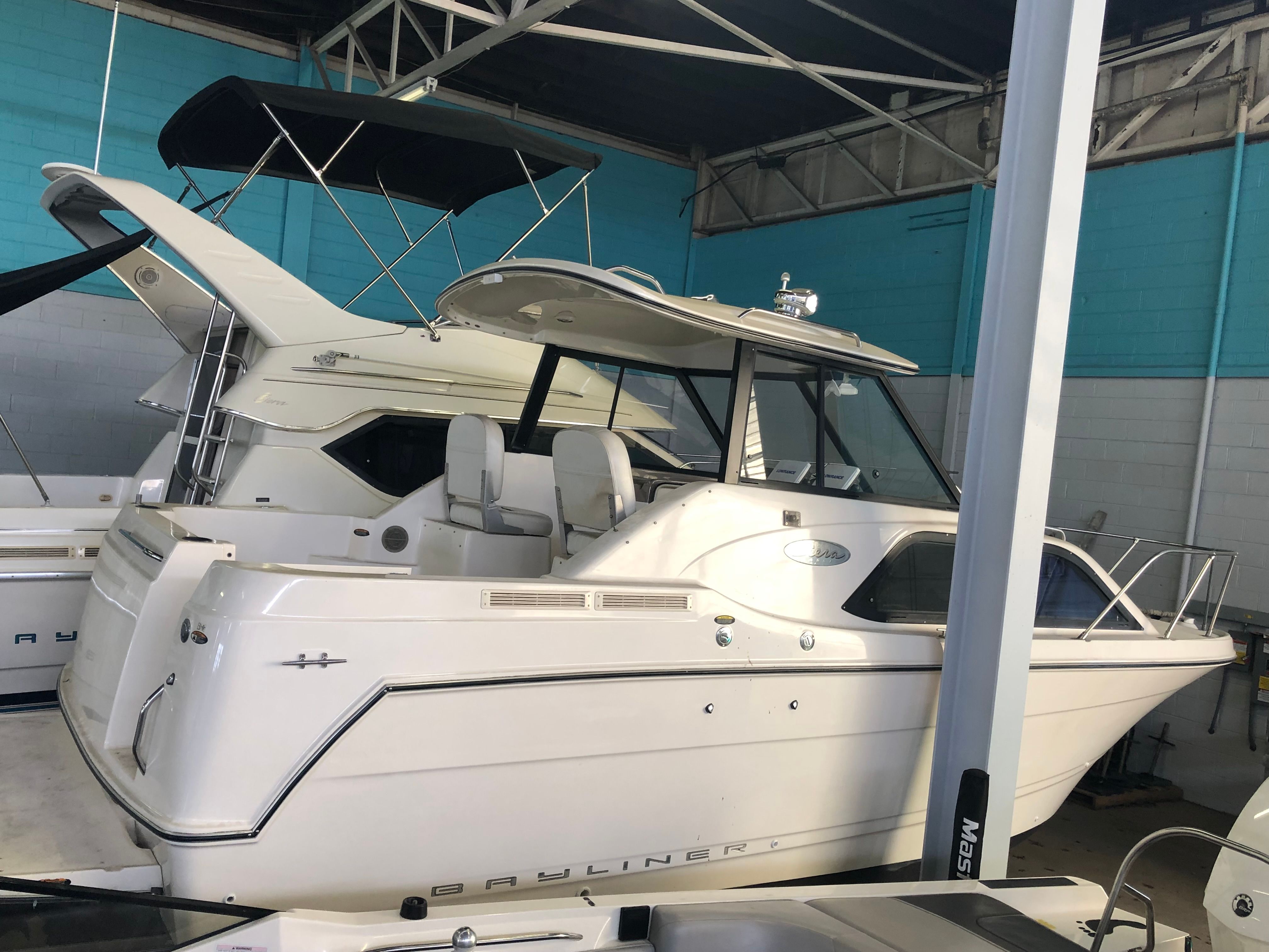 2003 Bayliner 2452 Classic Cruiser in a storage facility.