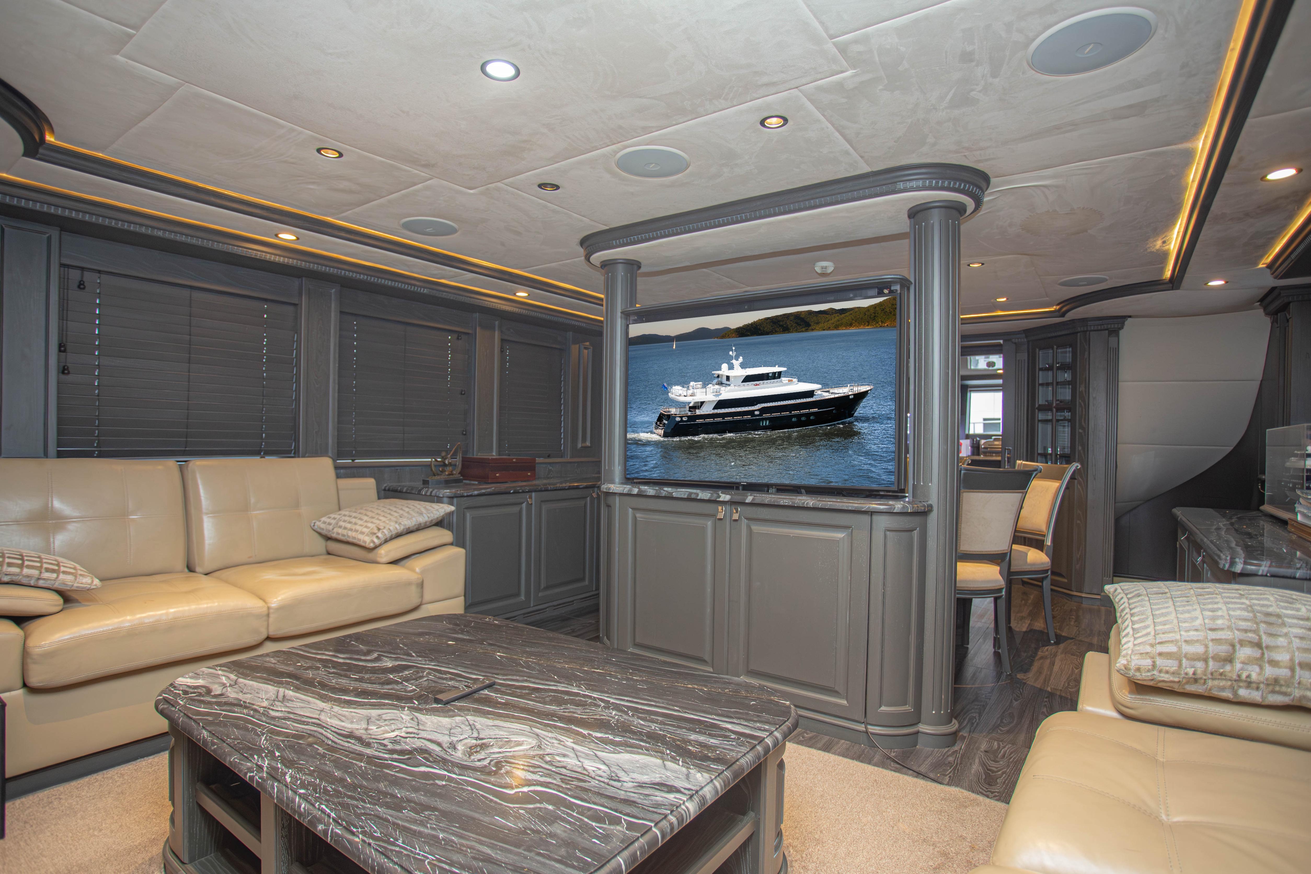 Luxurious interior of 2014 Fifth Ocean Yachts 24m Explorer Yacht with elegant seating and decor.