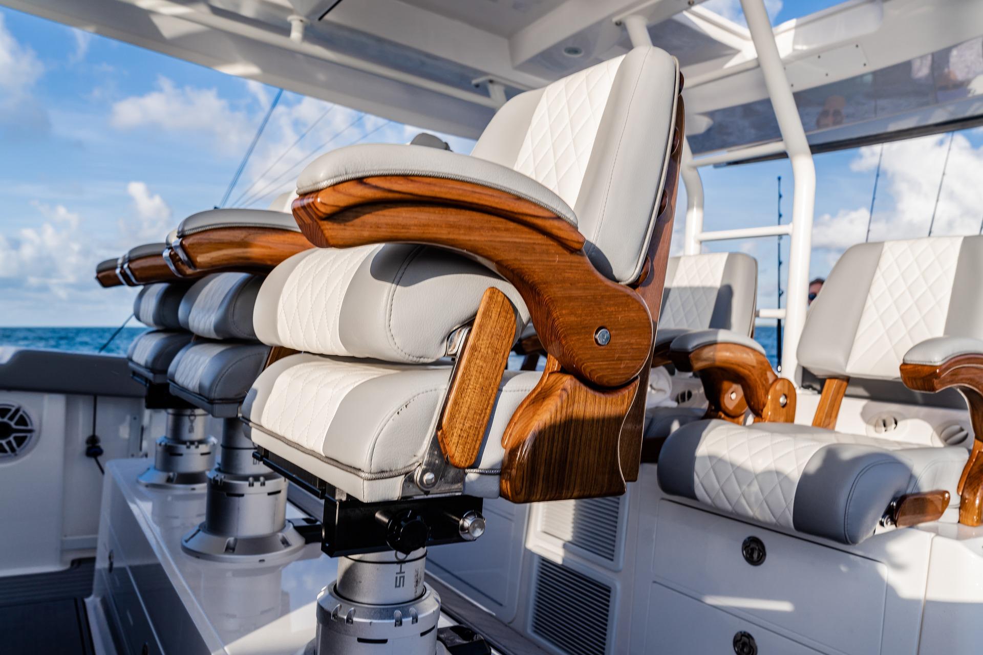 Luxurious seating on 2026 Everglades 455 Center Console boat, featuring elegant wood and leather design.