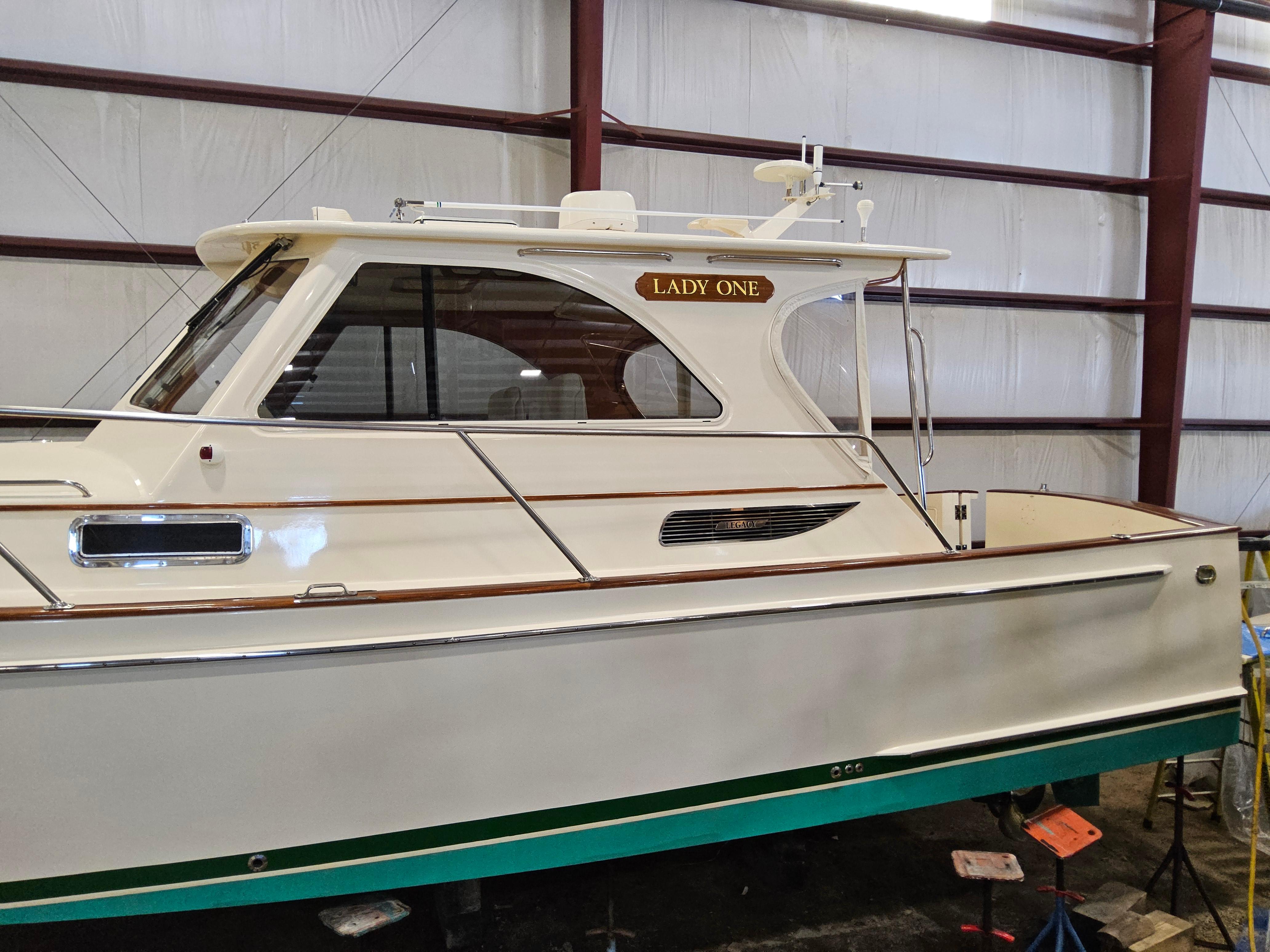 2003 Legacy 40 Hardtop Express boat named "Lady One" in a storage facility.