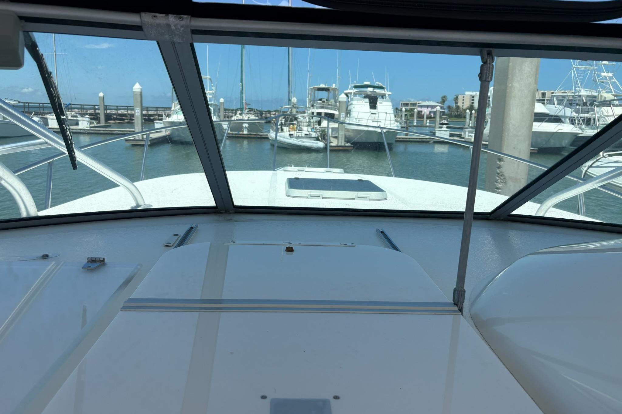 2008 Stamas 370 Express yacht docked at marina, viewed from cockpit.