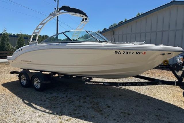 2023 Chaparral 23 SSi boat on trailer, parked outdoors.