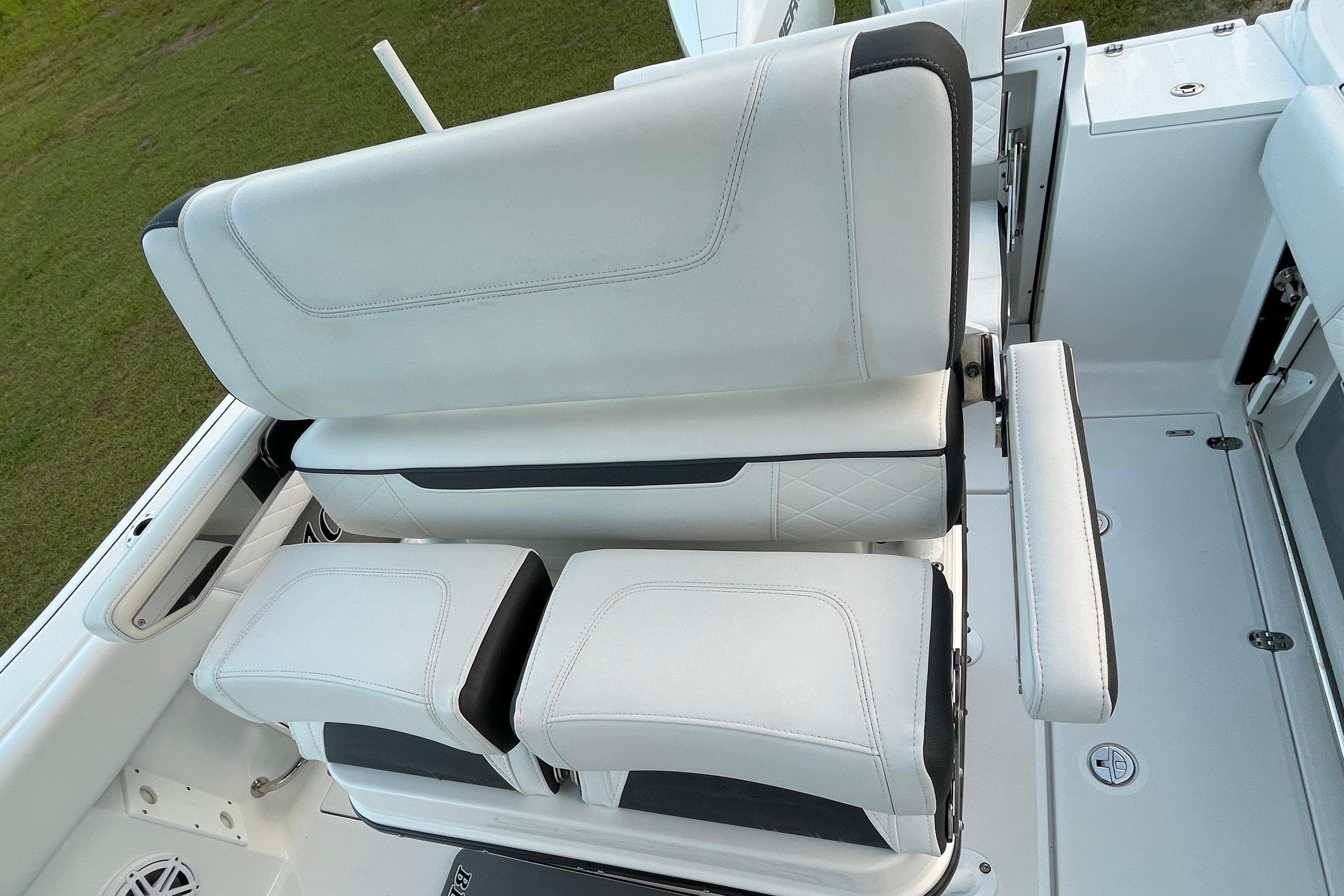 2022 Blackfin 252 CC boat seating with white upholstery and armrests.