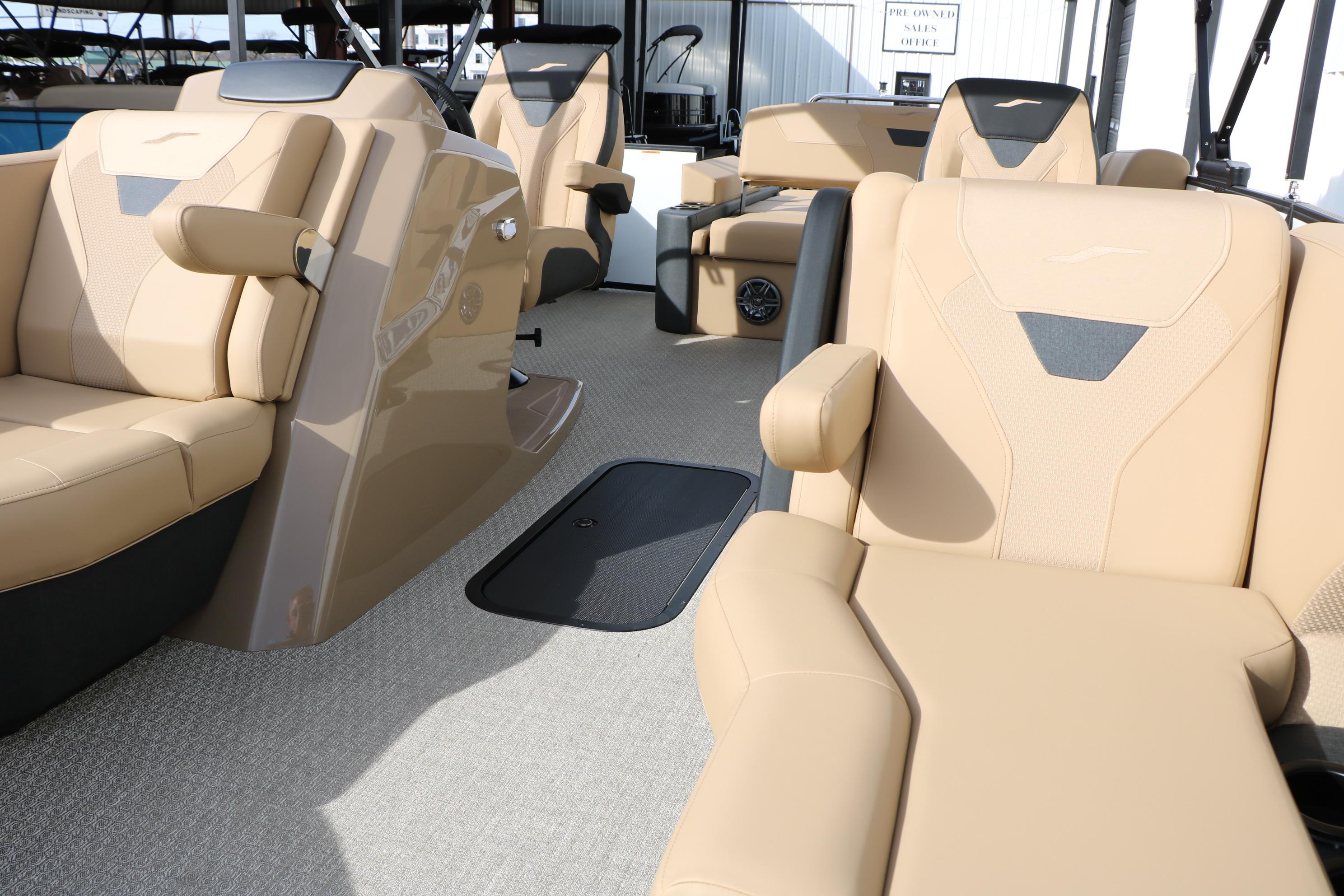 Luxurious interior of 2026 Evotti 523CS boat with beige seating and modern design.