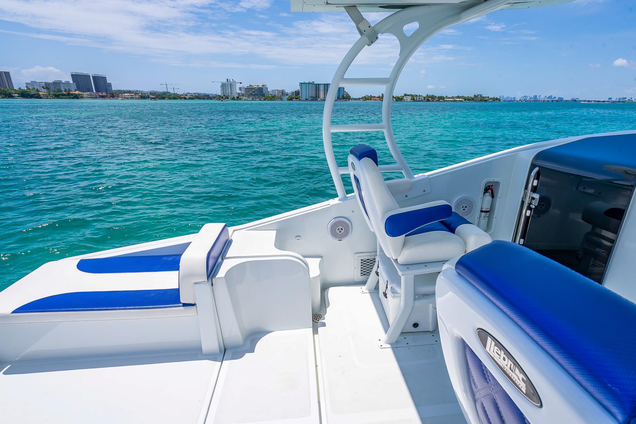 Nova 39 Sport 2020 boat with blue and white seating on clear ocean water.