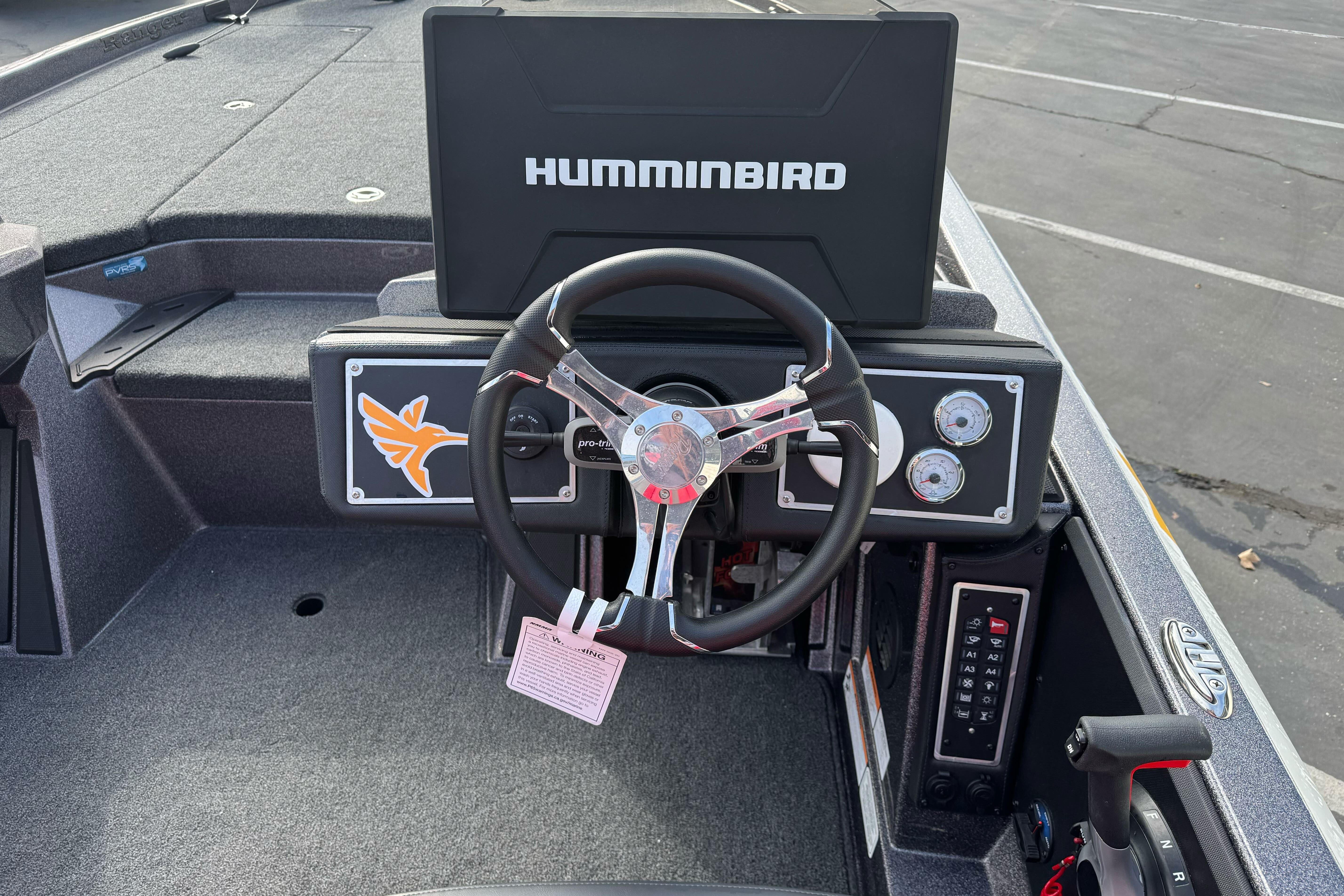 2025 Ranger Z521 boat dashboard with Humminbird display and steering wheel.