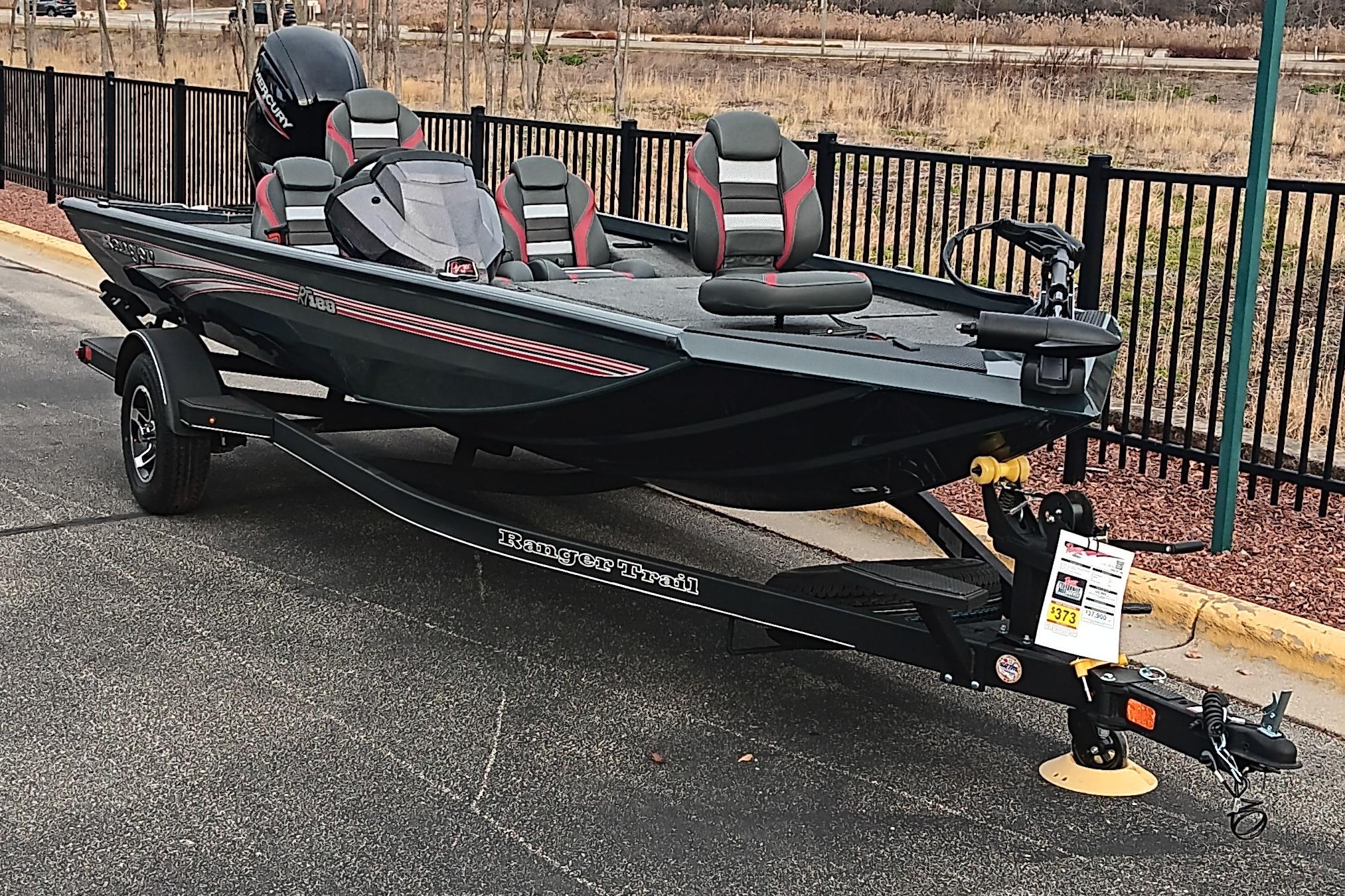 2026 Ranger RT188 fishing boat on trailer, parked outdoors.