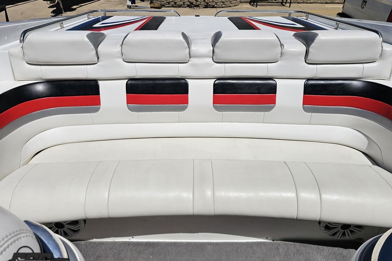 2005 Formula 271 FASTech boat interior with white, black, and red seating.