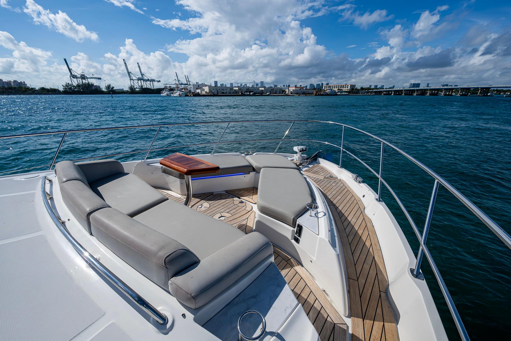 Luxurious 2018 Sea Ray L550 Fly yacht with spacious deck and scenic ocean view.