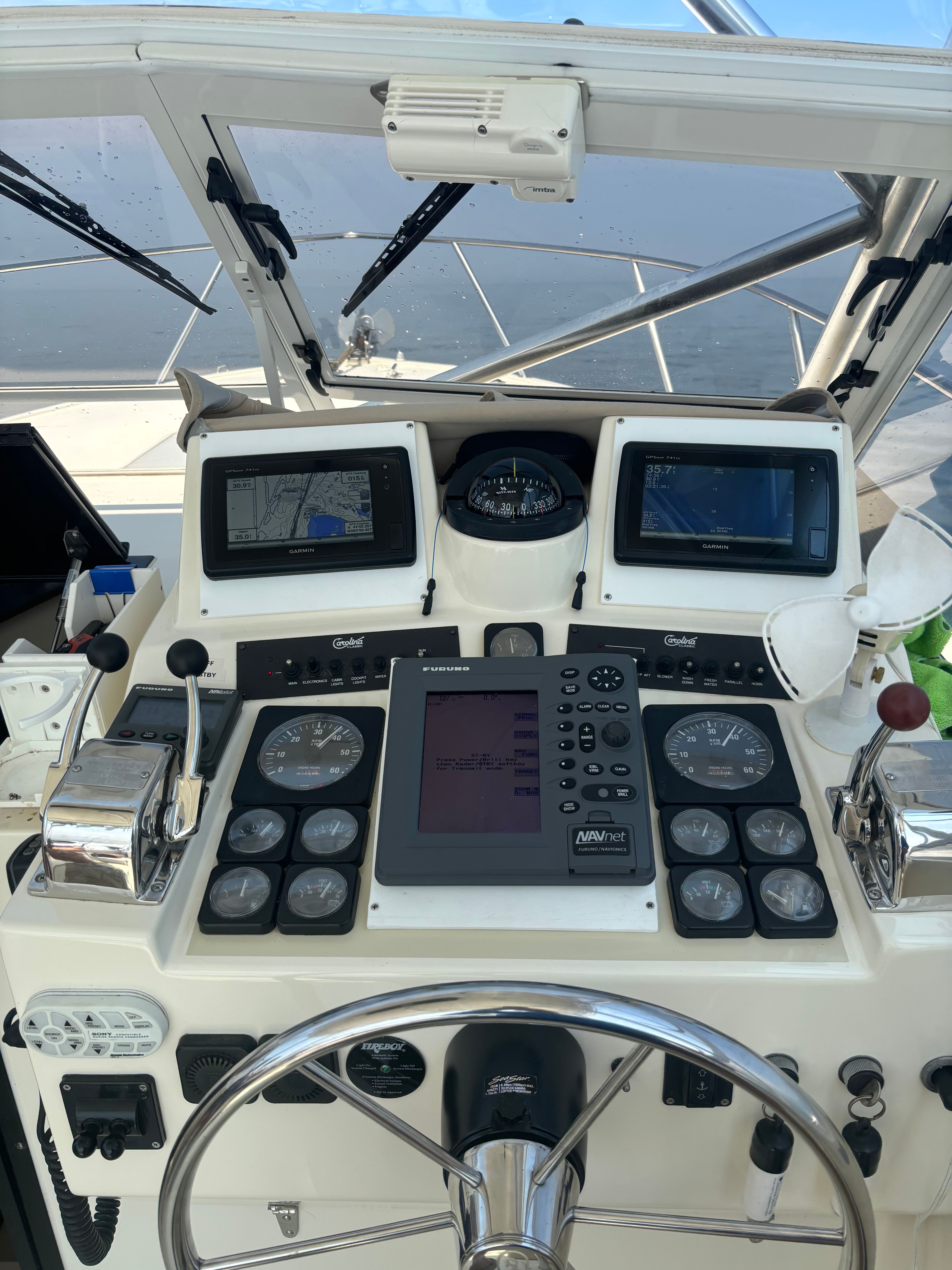 Helm console of a 2004 Carolina Classic 28 Express boat.