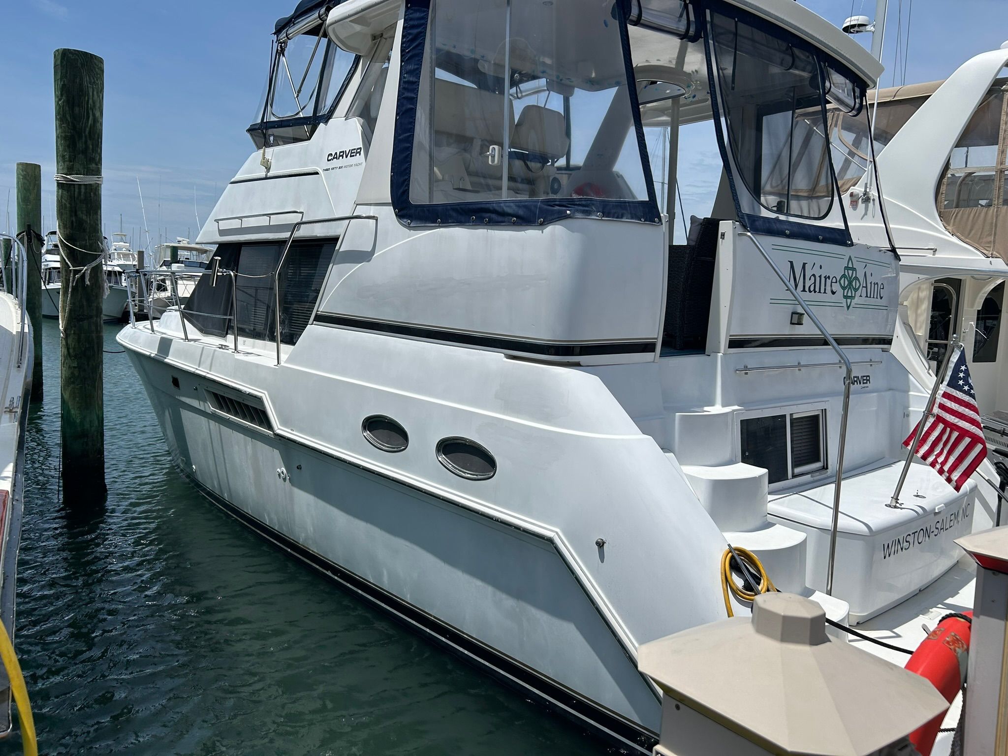2000 Carver 356 Aft Cabin Motor Yacht docked at marina.