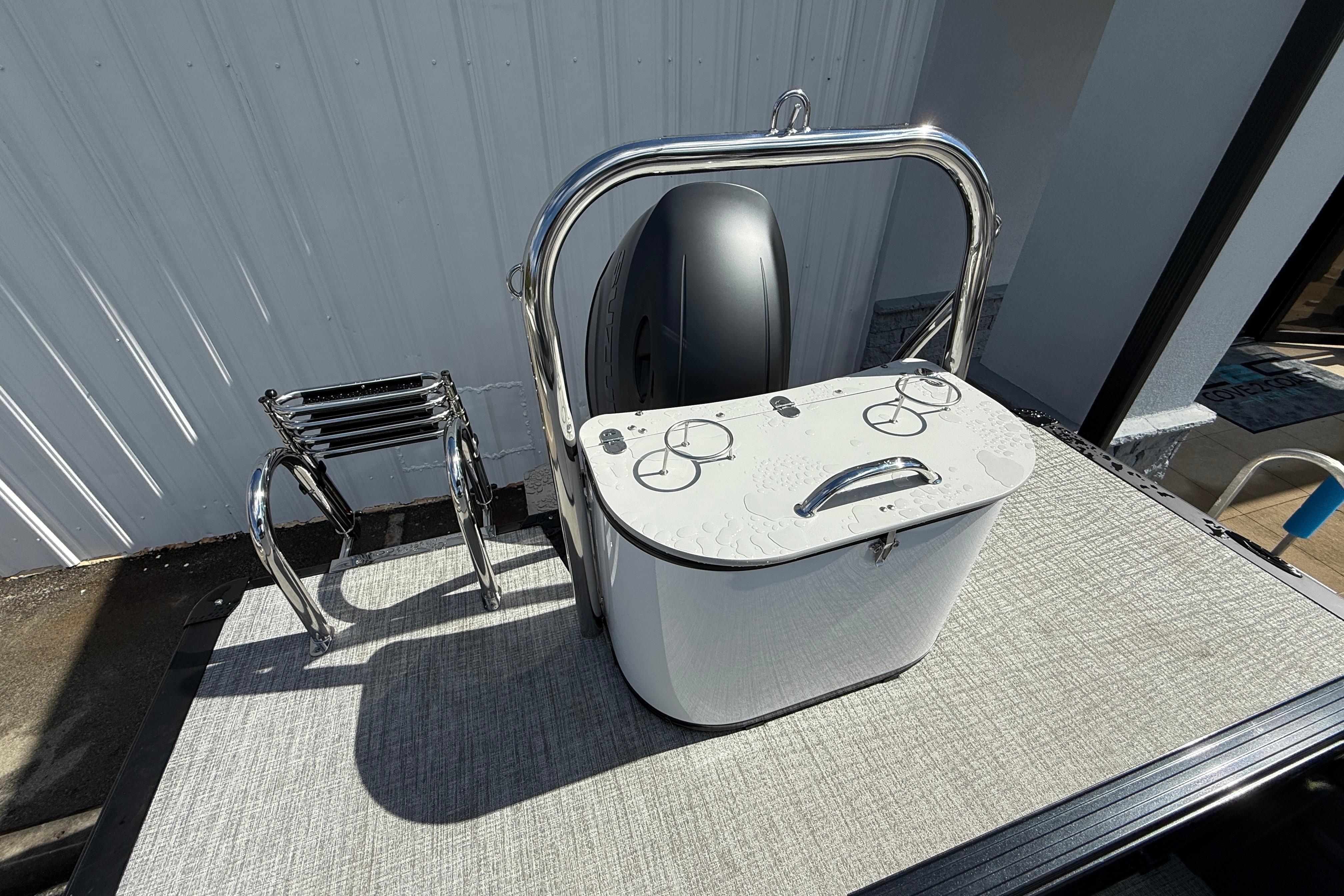 2026 Tahoe Pontoon LTZ Quad Lounger with stainless steel ladder and storage compartment.
