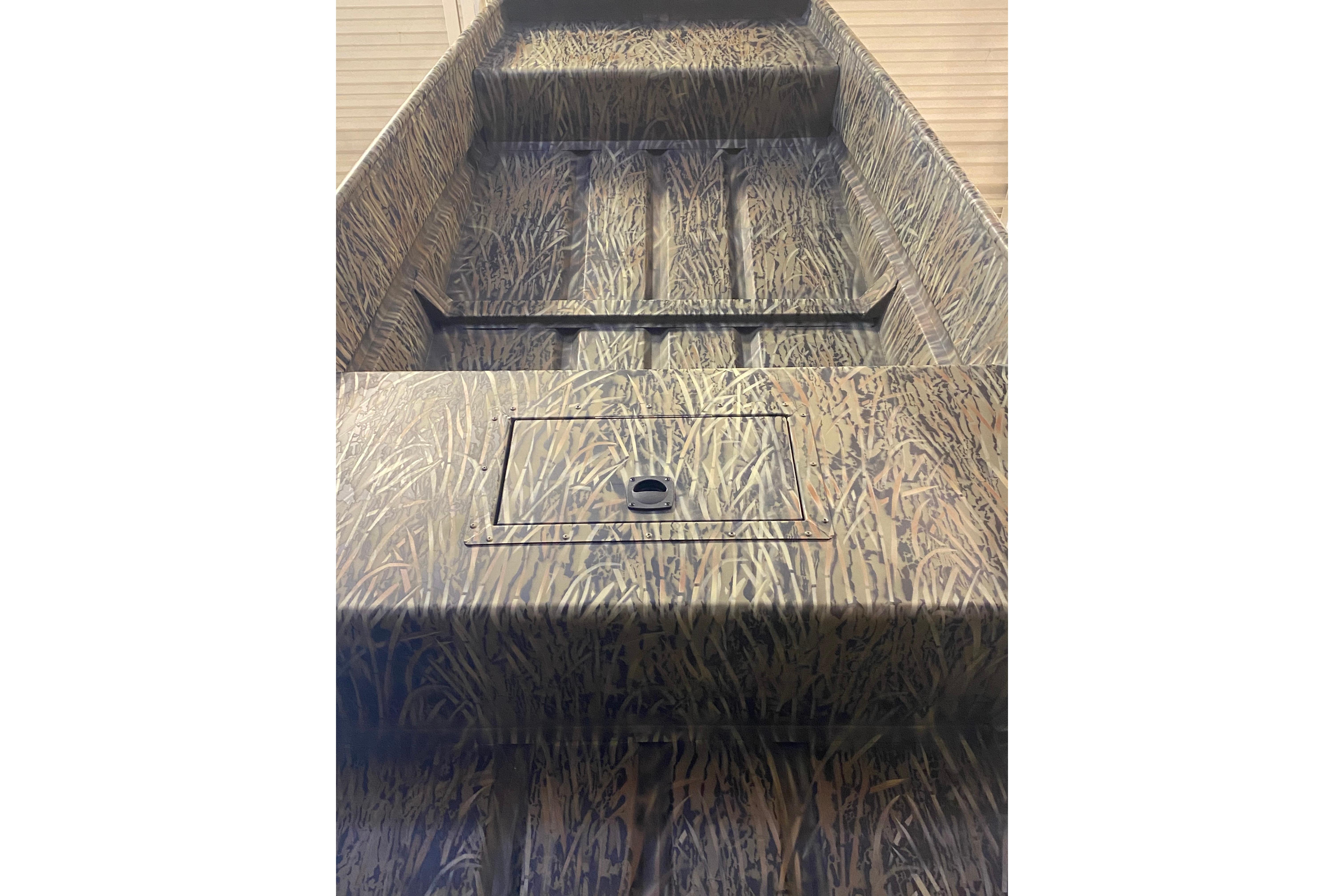 2026 Tracker Grizzly 15 Jon boat with camouflage pattern, interior view.