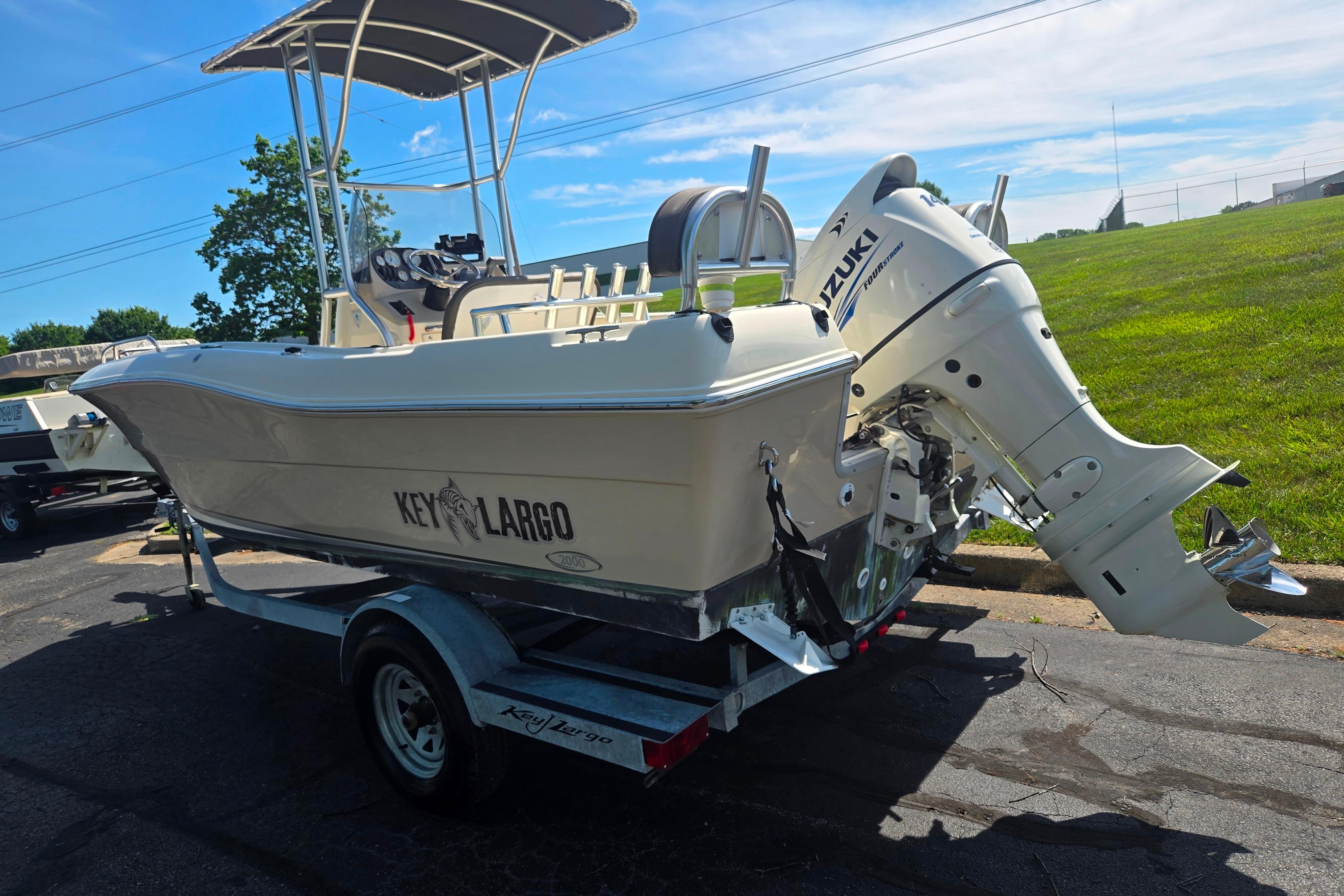 2016 Key Largo 2000CC boat with Suzuki outboard motor on trailer.