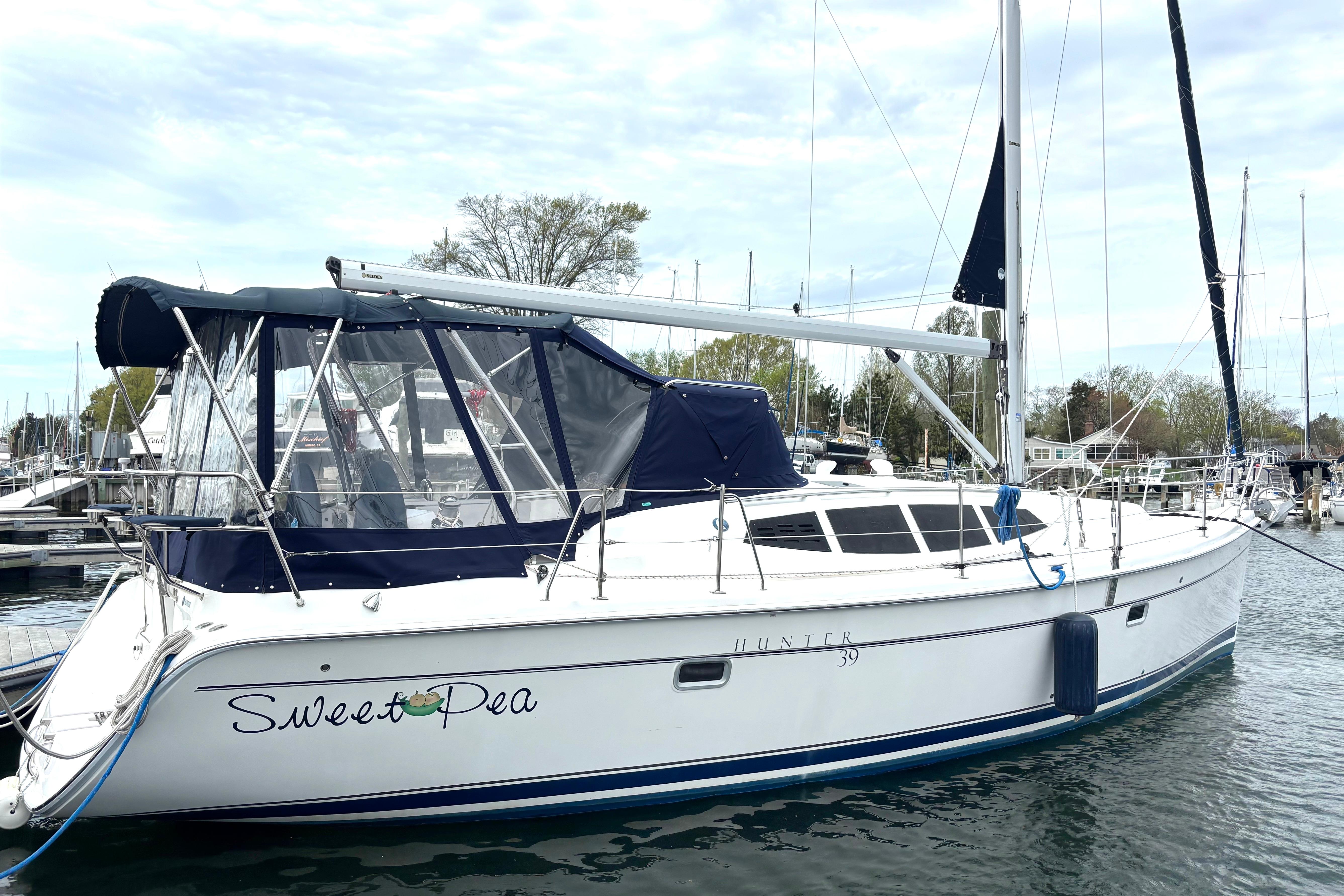 2011 Hunter 39 sailboat named "Sweet Pea" docked at a marina.