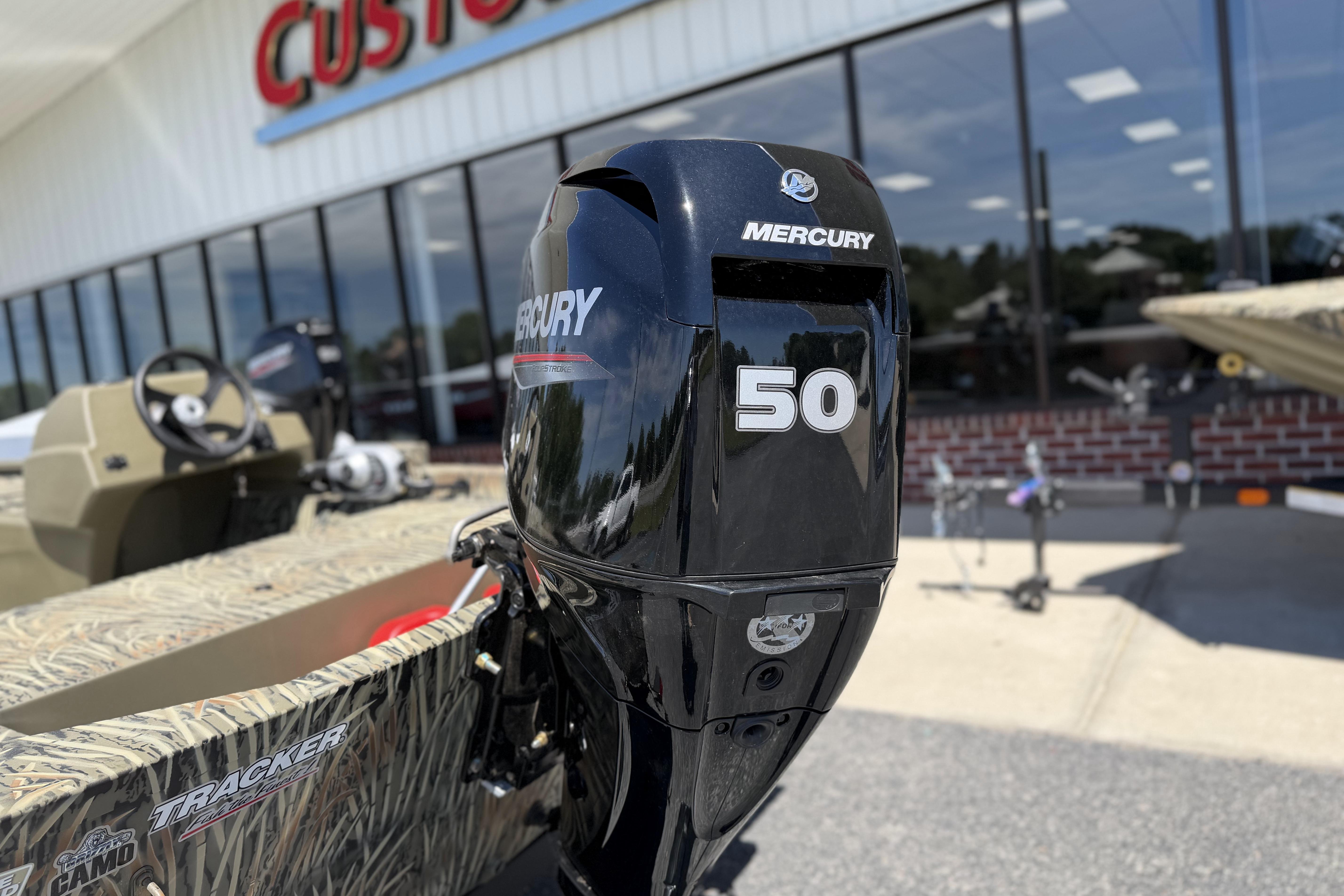 2026 Tracker Grizzly 1648 SC with Mercury 50 outboard motor at dealership.