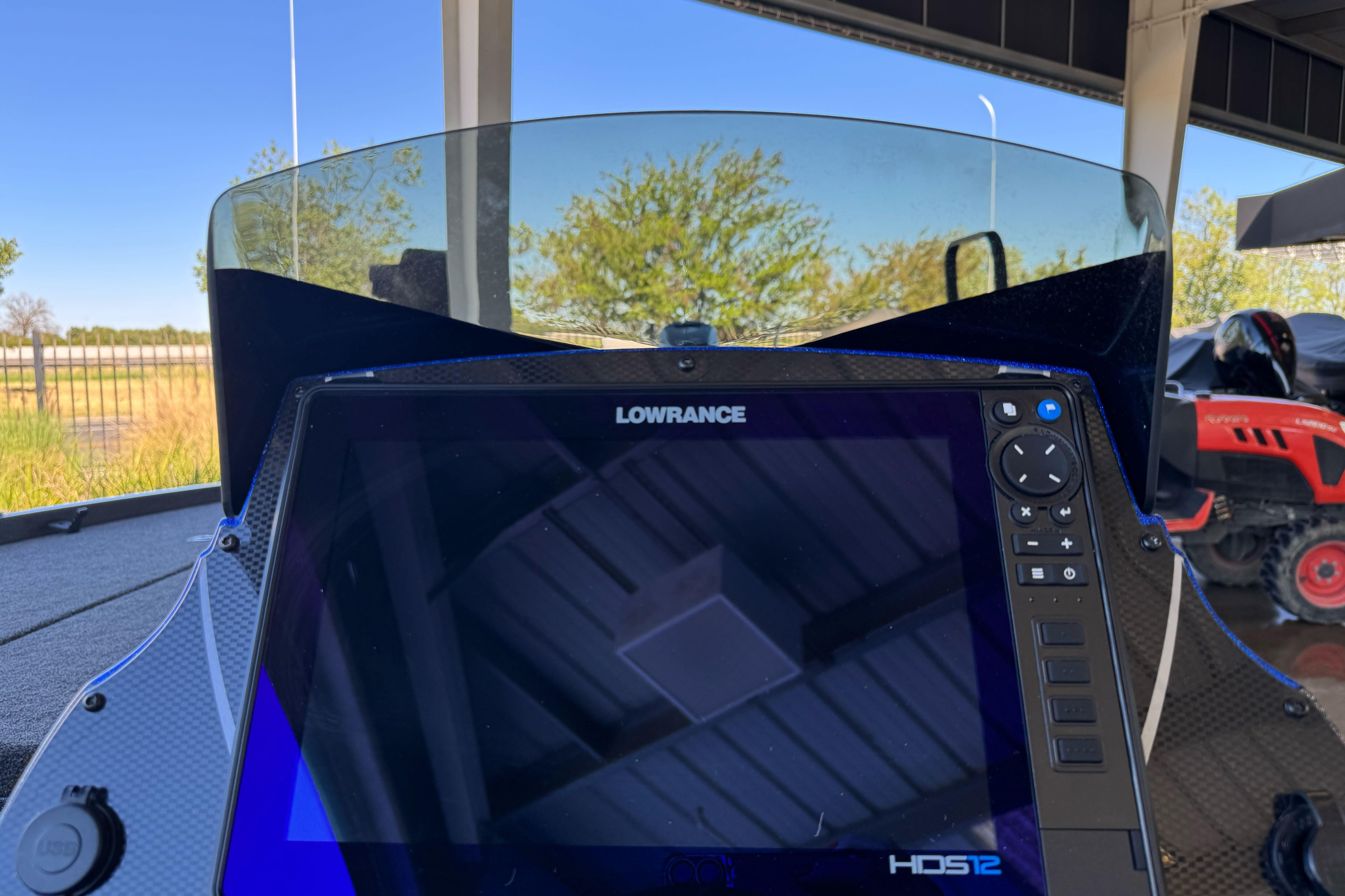 Lowrance HDS12 display on 2026 Triton 21XP Patriot boat dashboard.