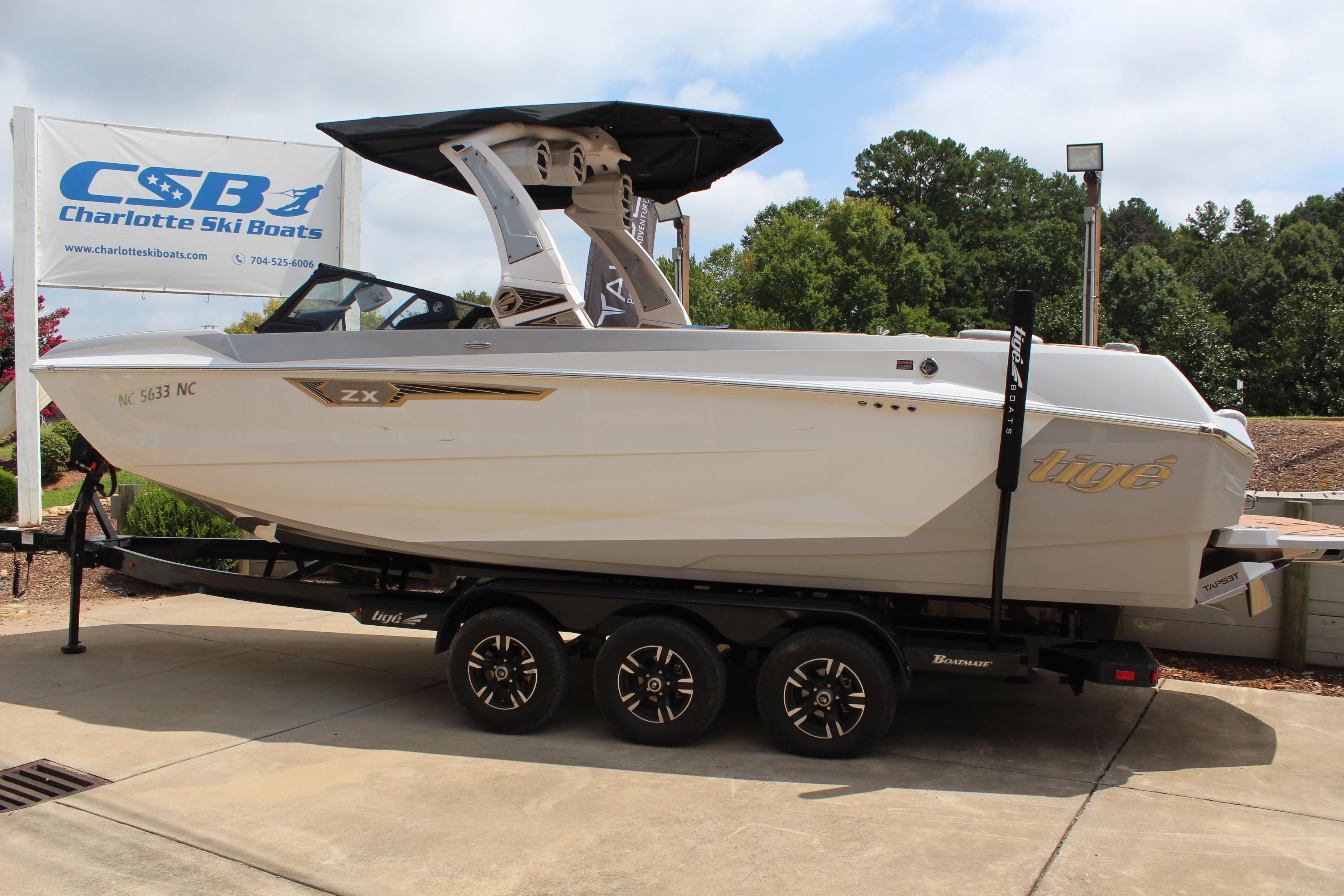2024 Tigé Ultré 25ZX boat on trailer at Charlotte Ski Boats dealership.