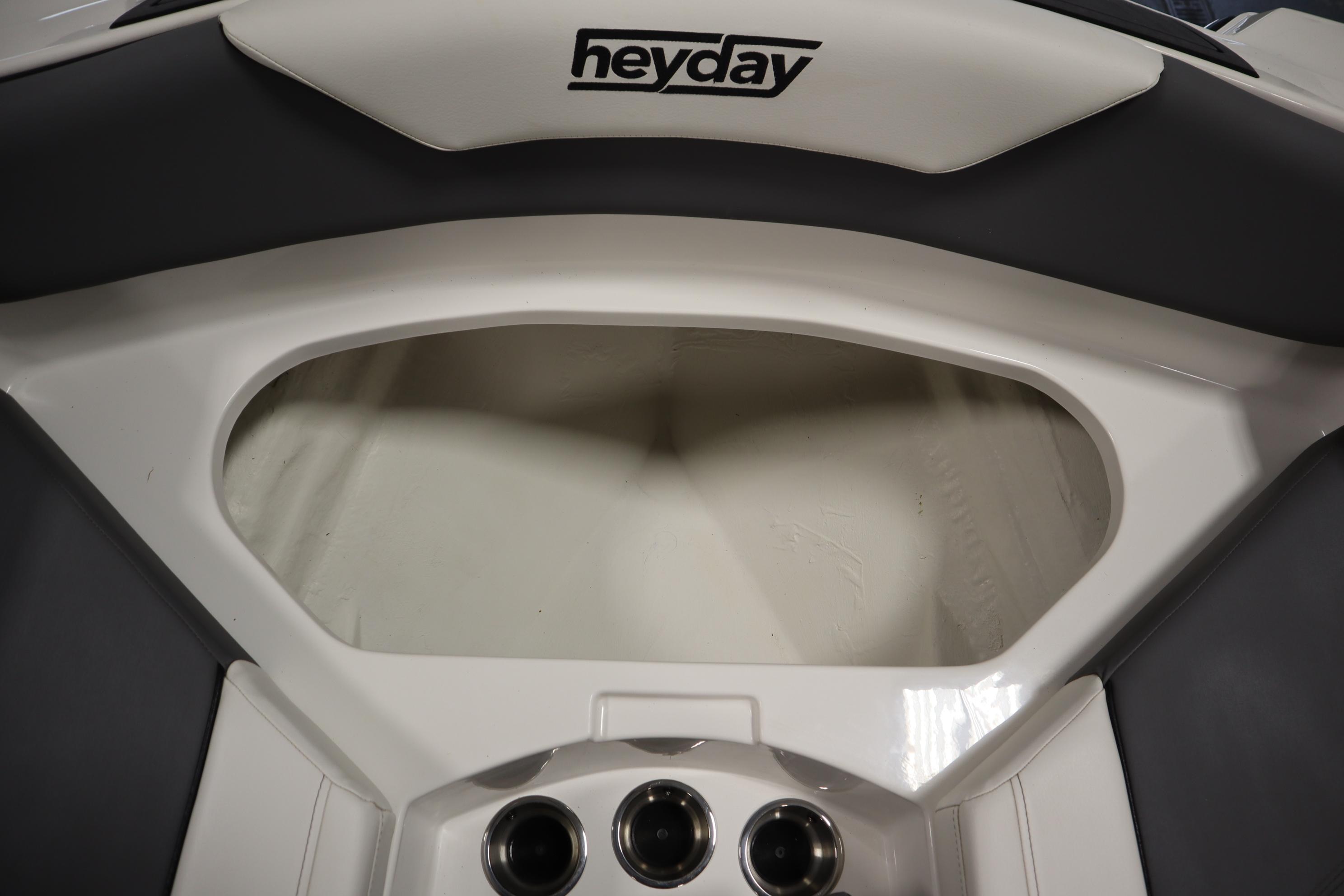 2023 Heyday WT Surf boat interior storage compartment with cup holders.