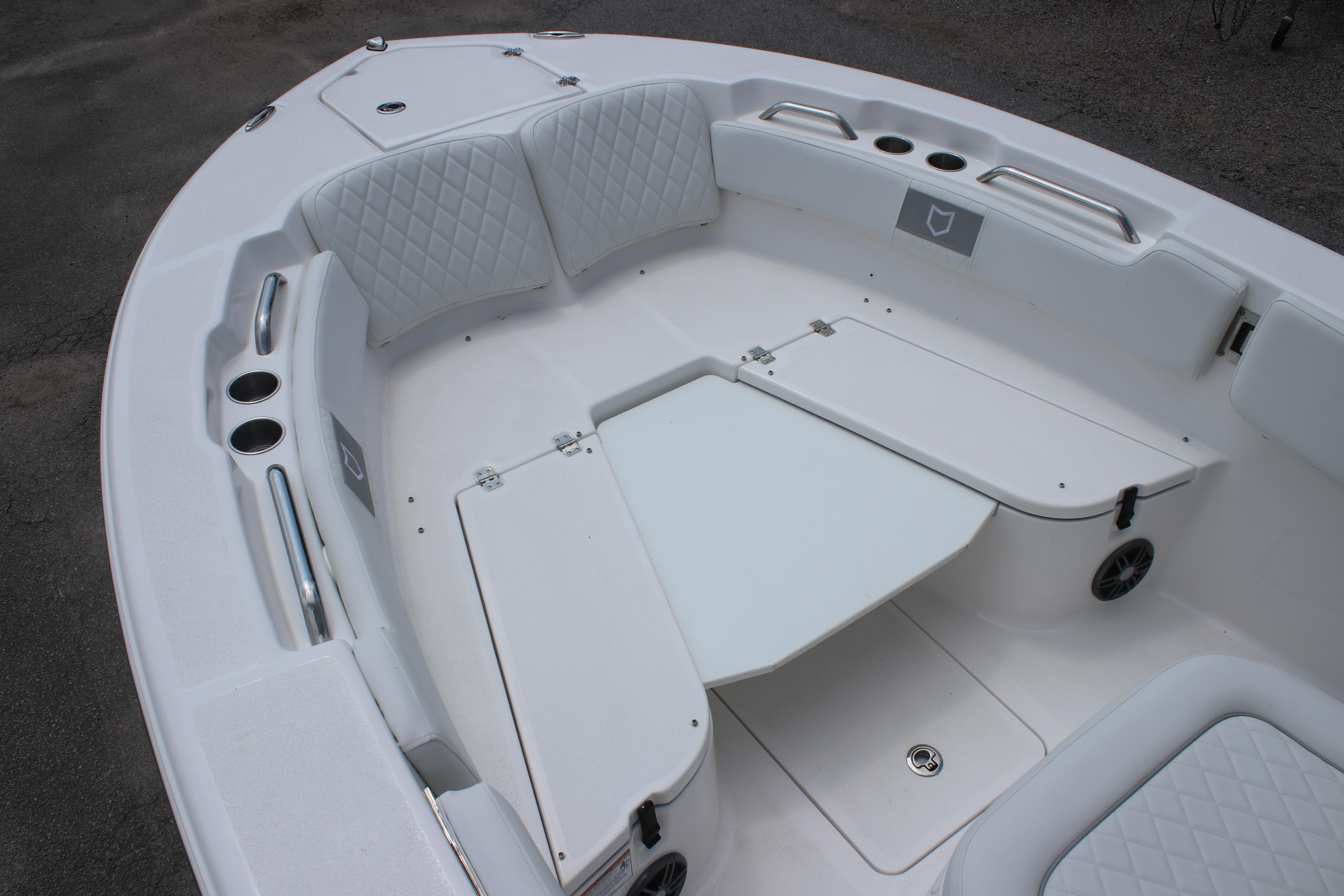2026 Sea Fox 248 Commander boat interior with cushioned seating and storage compartments.