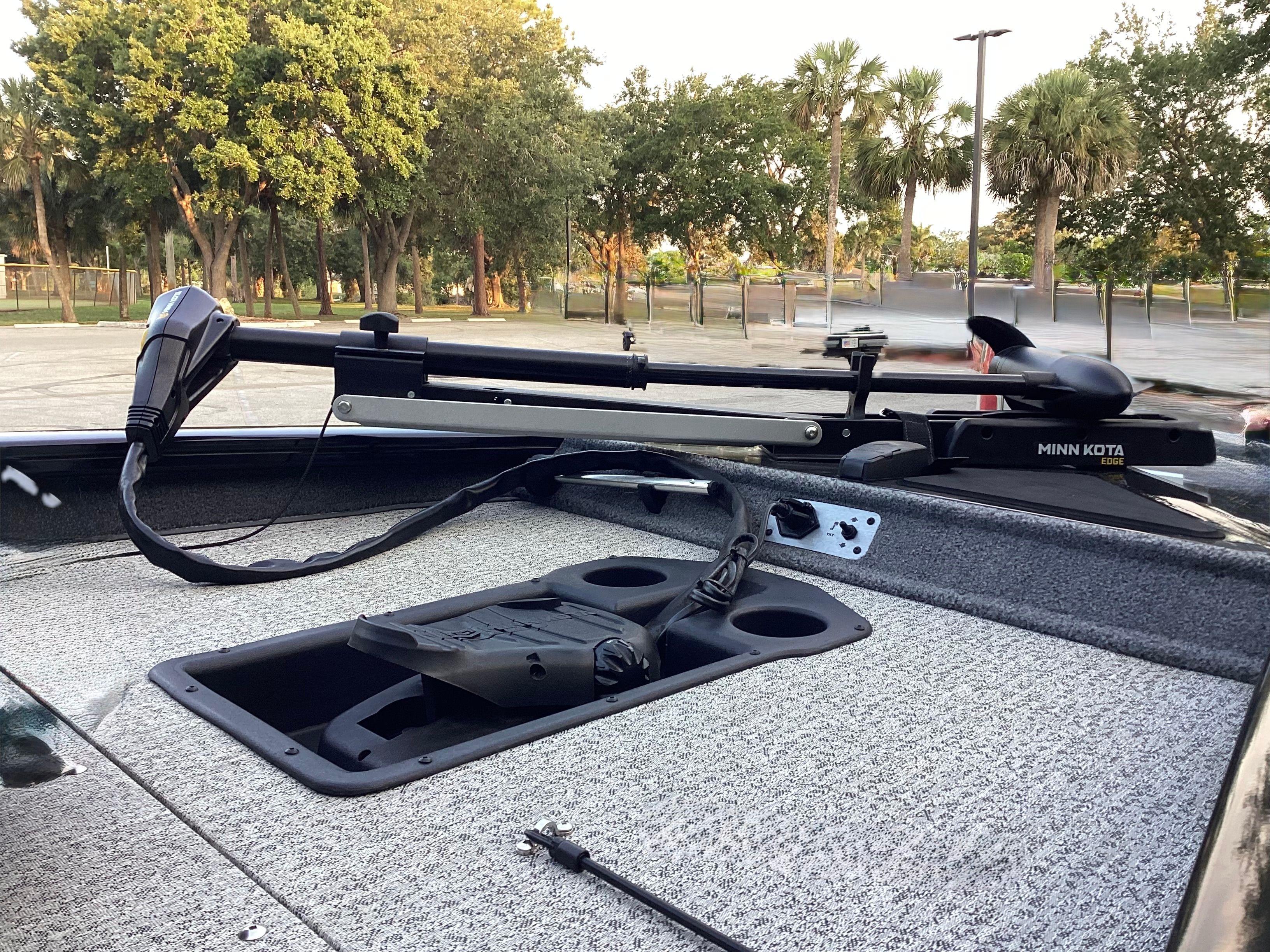 2023 Tracker PRO boat with Minn Kota motor on parking lot.
