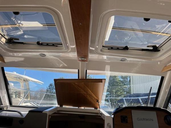 Interior view of 2025 Cutwater C-248 C Coupe with sunroof and Garmin navigation system.