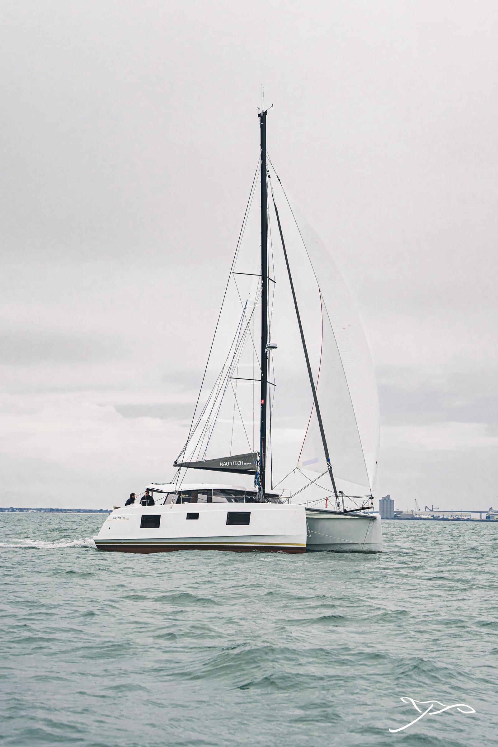 2025 Nautitech 40 Open catamaran sailing on calm waters under a cloudy sky.