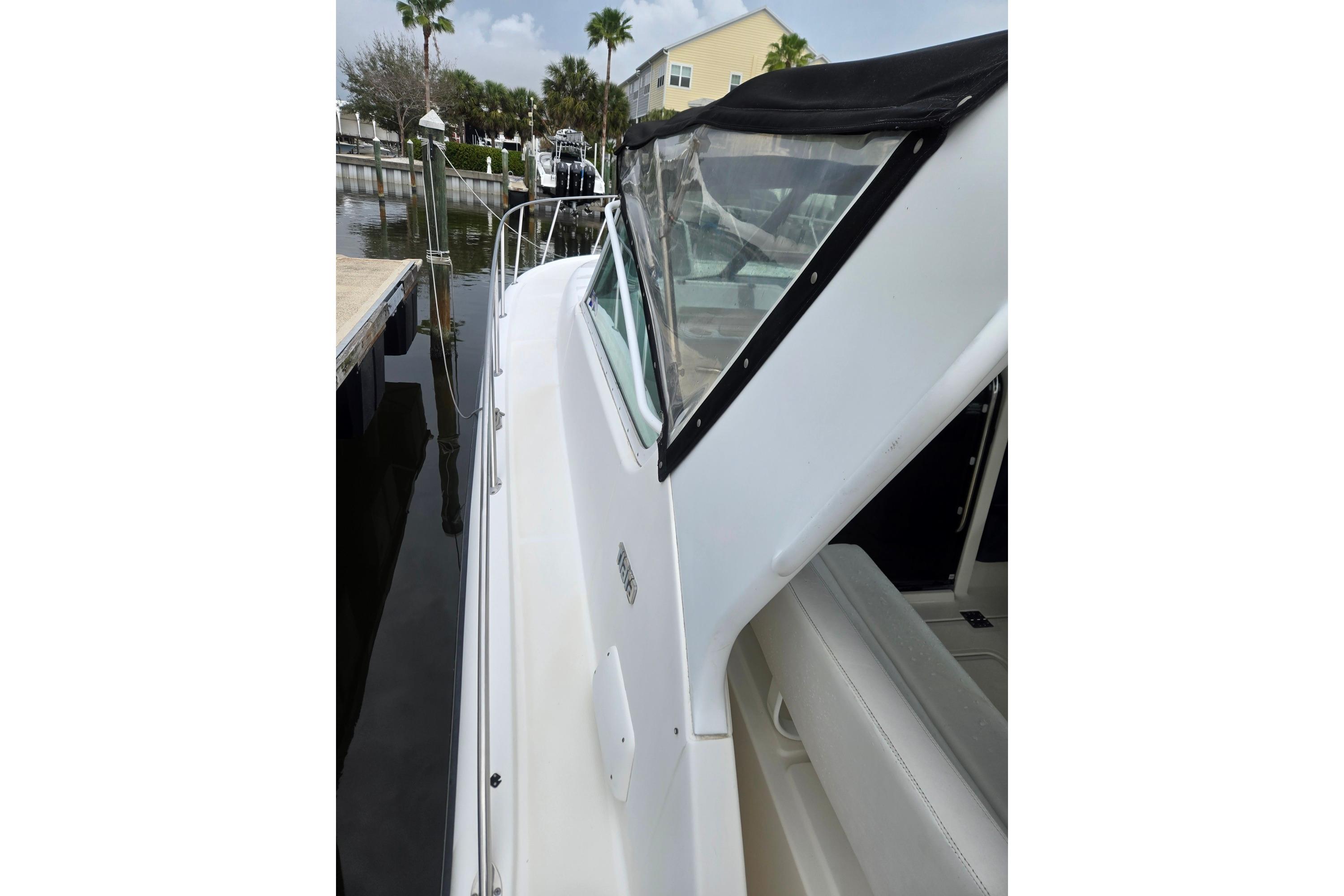 2002 Tiara Yachts 3500 Open docked, showcasing sleek white exterior and canopy.