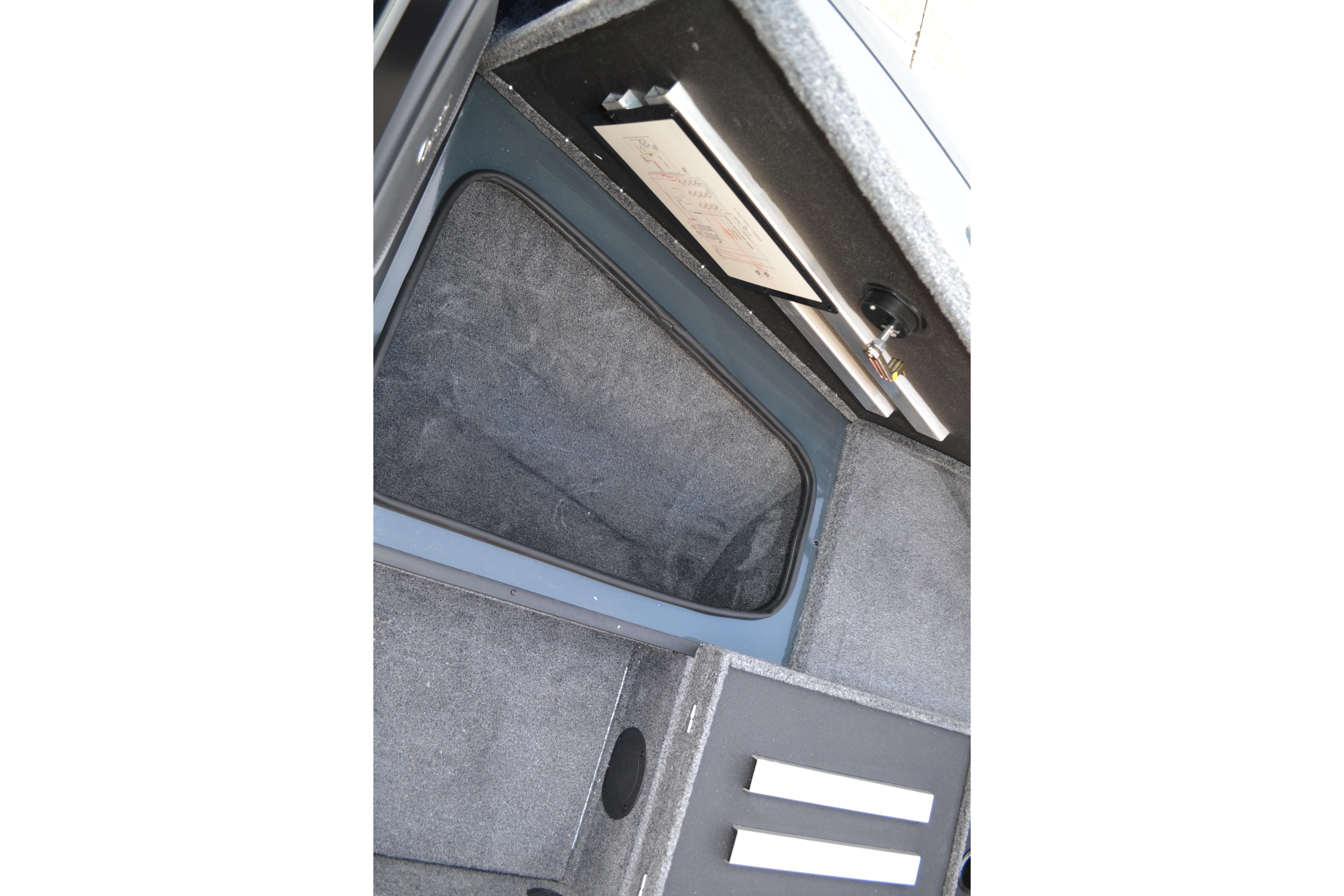 Interior storage compartment of 2026 Ranger VX1888 WT boat, featuring carpeted finish.
