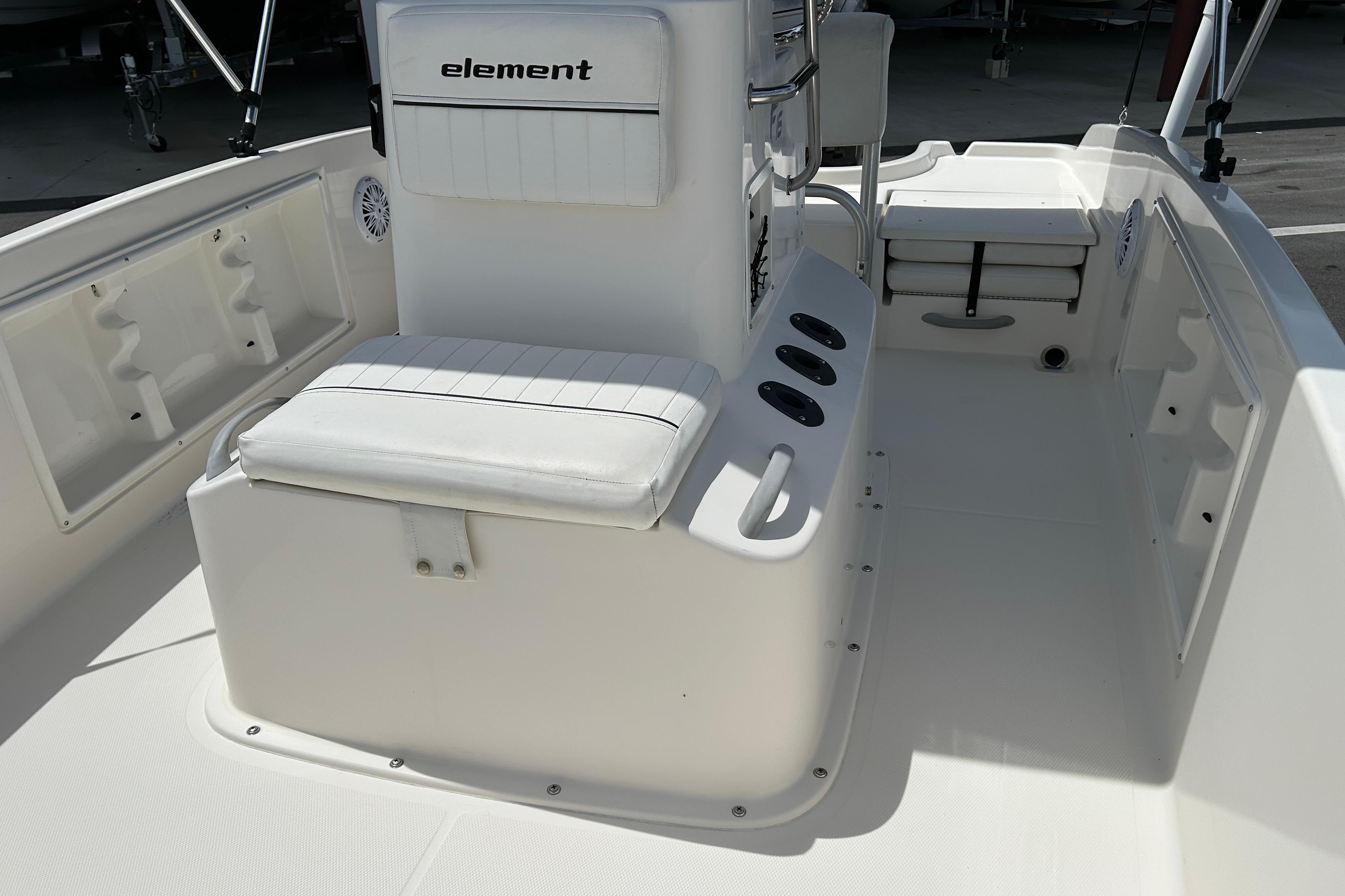 2018 Bayliner Element F16 boat interior with white seating and storage compartments.