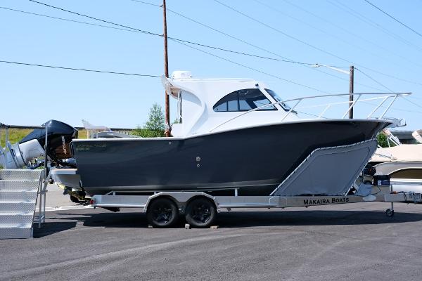 2023 Makaira Gen3 800 boat on trailer, sleek design, parked outdoors.