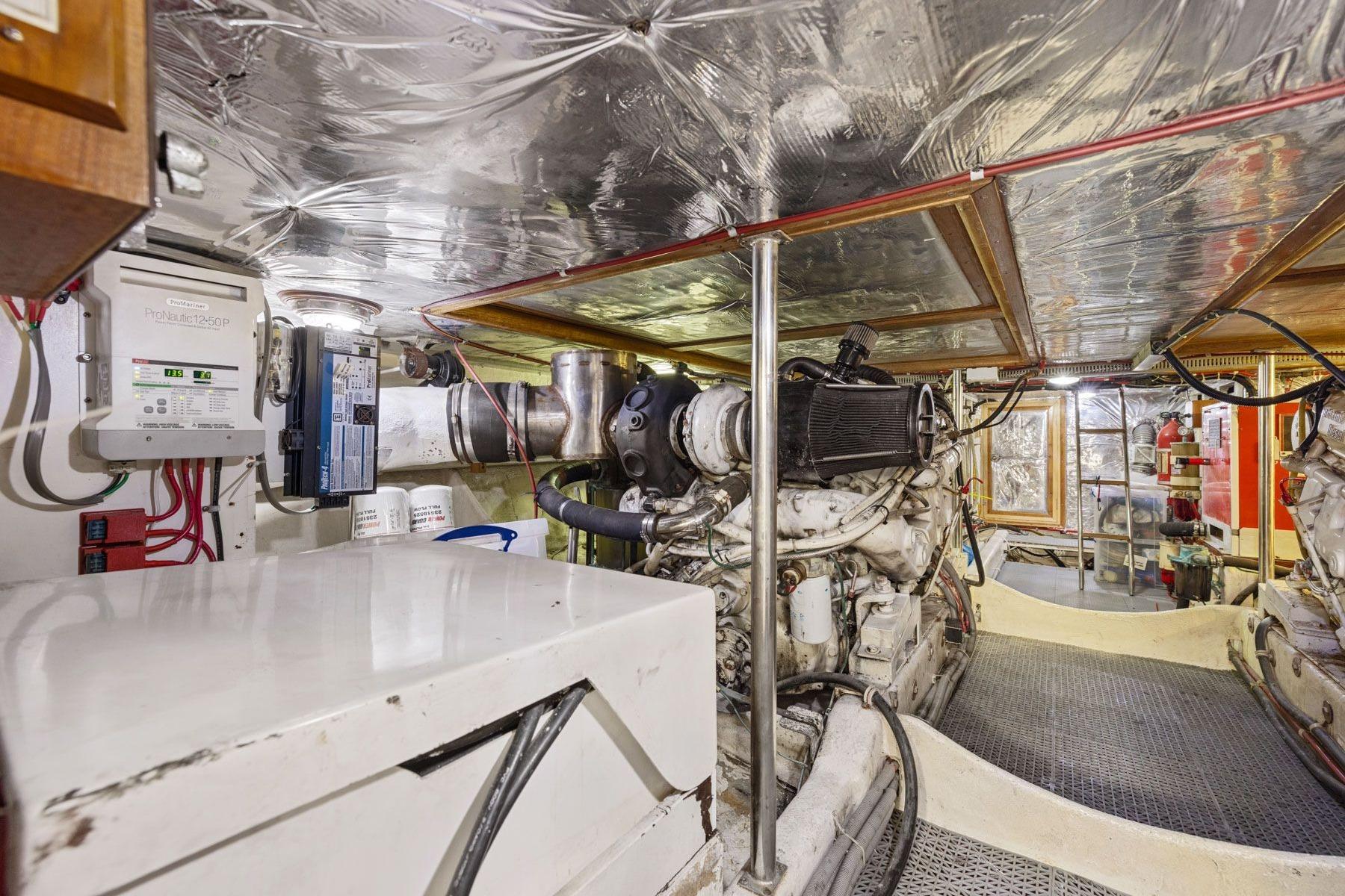 Engine room of 1991 Ocean Alexander 520 Pilothouse yacht, showcasing machinery and equipment.