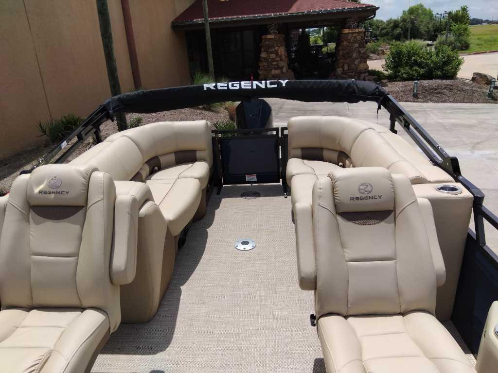 2025 Regency 250 LE3 pontoon boat with luxurious beige seating and spacious interior.
