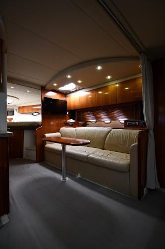 Interior of 2010 Cruisers Yachts 390 Sports Coupe, featuring elegant seating and modern lighting.