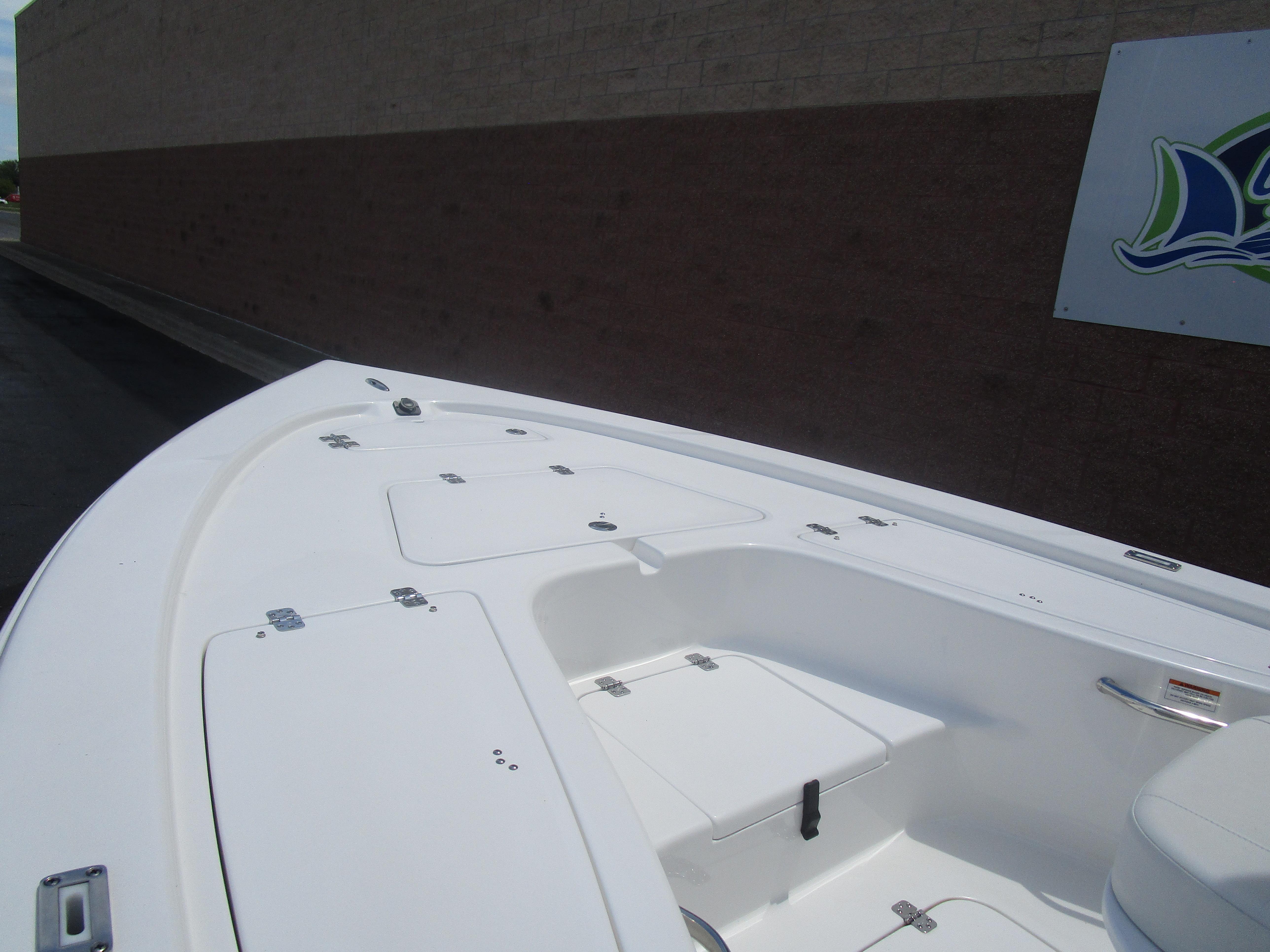 2025 Sea Pro 230 DLX BAY boat deck with storage compartments.