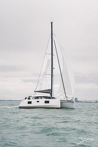 2025 Nautitech 40 Open catamaran sailing on calm waters under a cloudy sky.