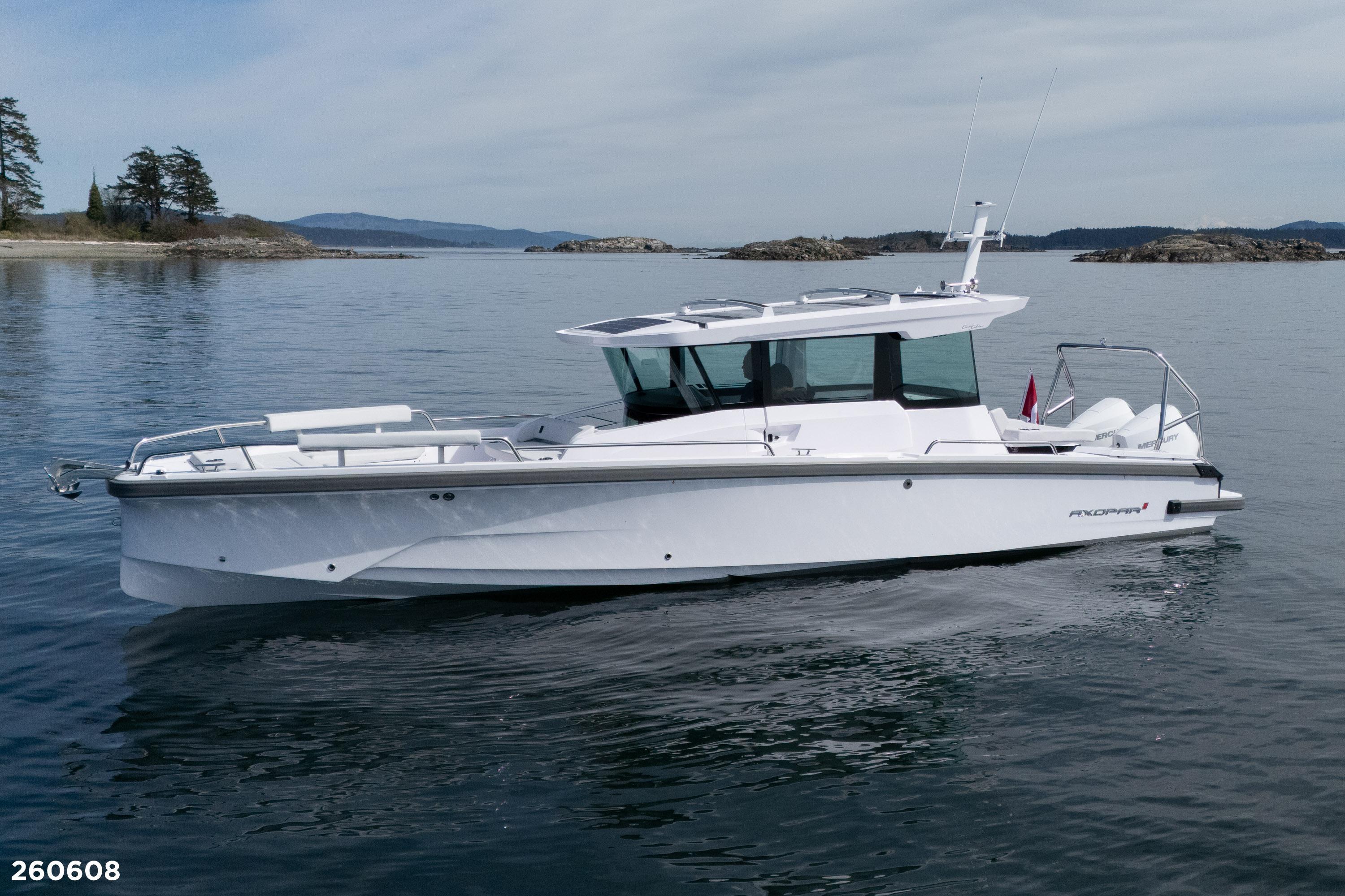 2026 Axopar 29 XC Cross Cabin boat cruising on calm waters.