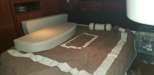 Interior cabin of 2010 Meridian 441 Sedan with bed and cushions.