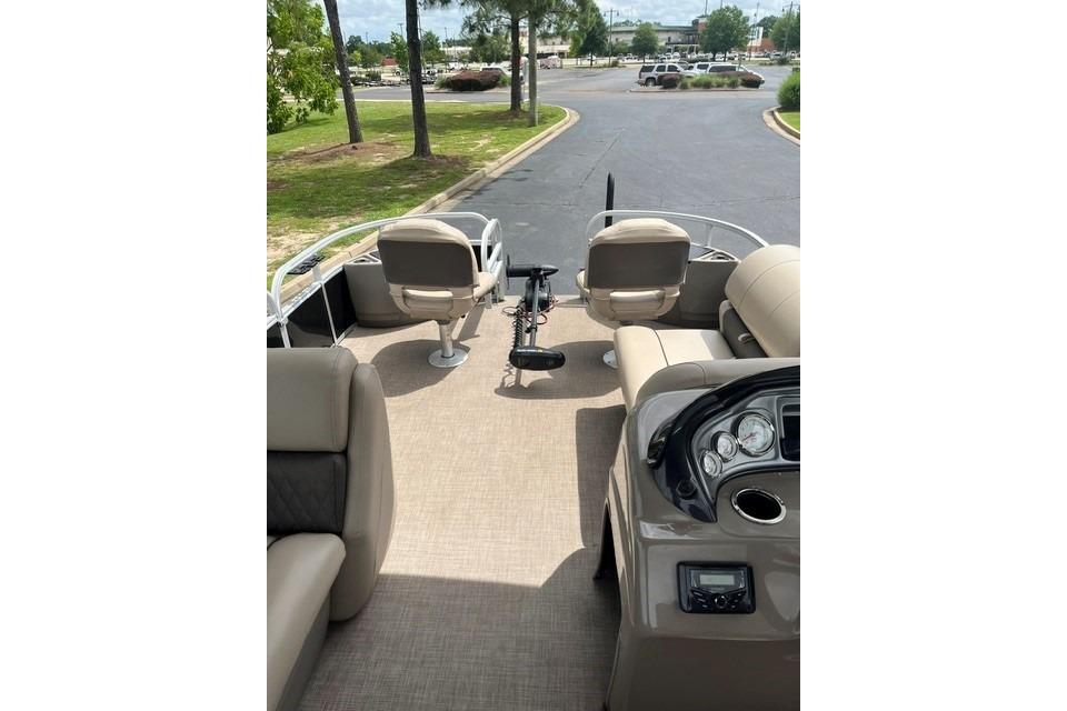 2023 SUNTRACKER Fishing Barge 20 interior with seating and control panel.