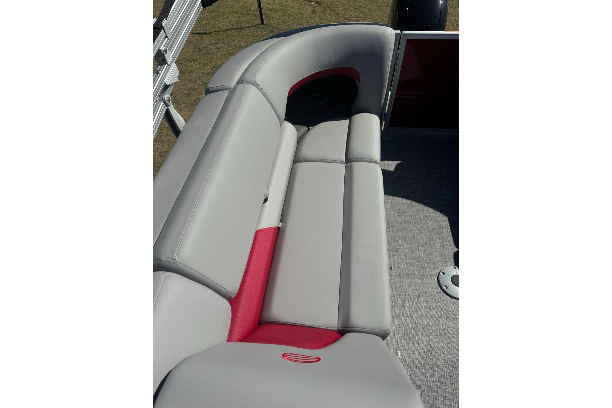 2026 Sun Tracker Party Barge 22 XP3 pontoon boat with gray and red seating.