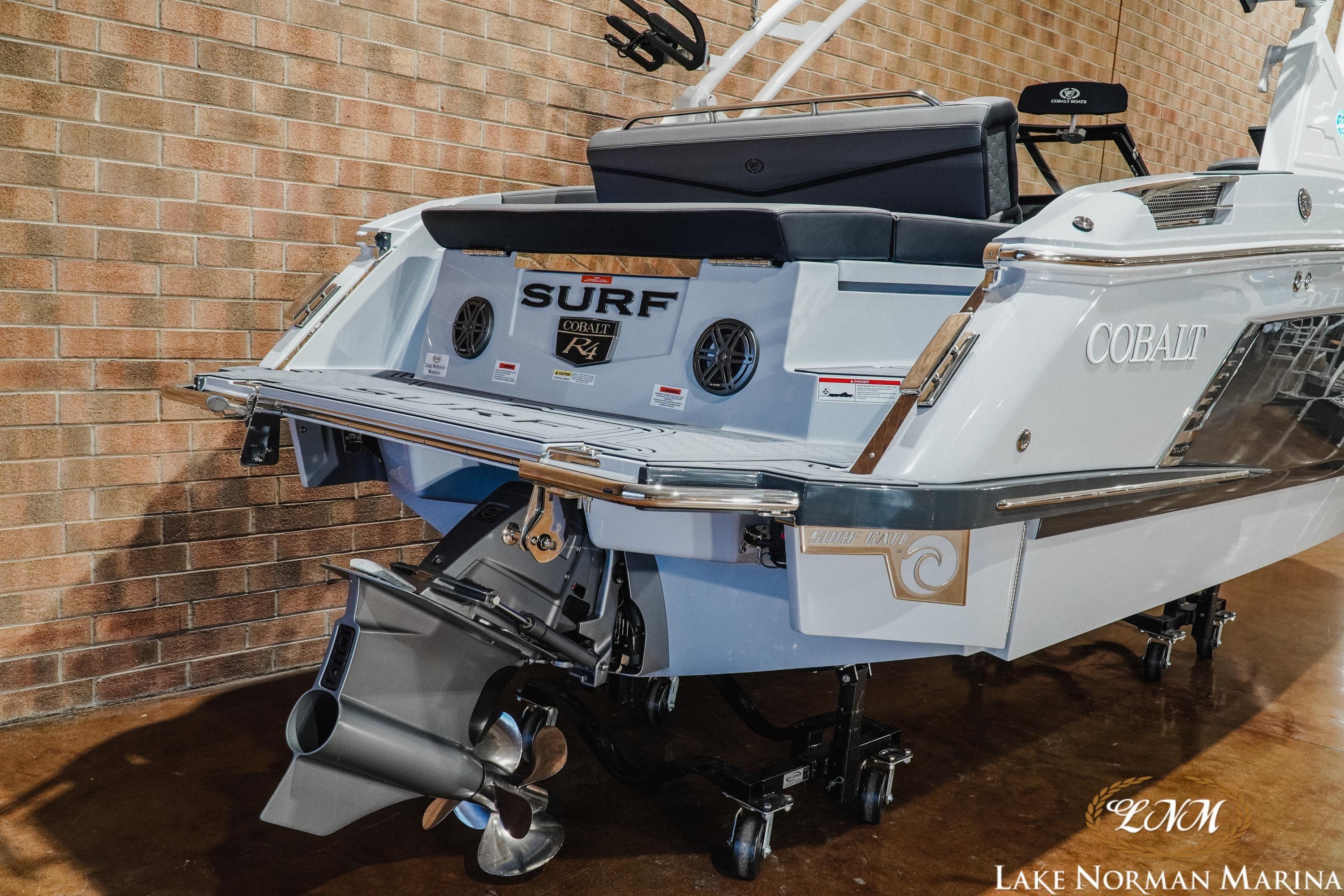 2026 Cobalt R4 Surf boat at Lake Norman Marina, showcasing sleek design and powerful engine.