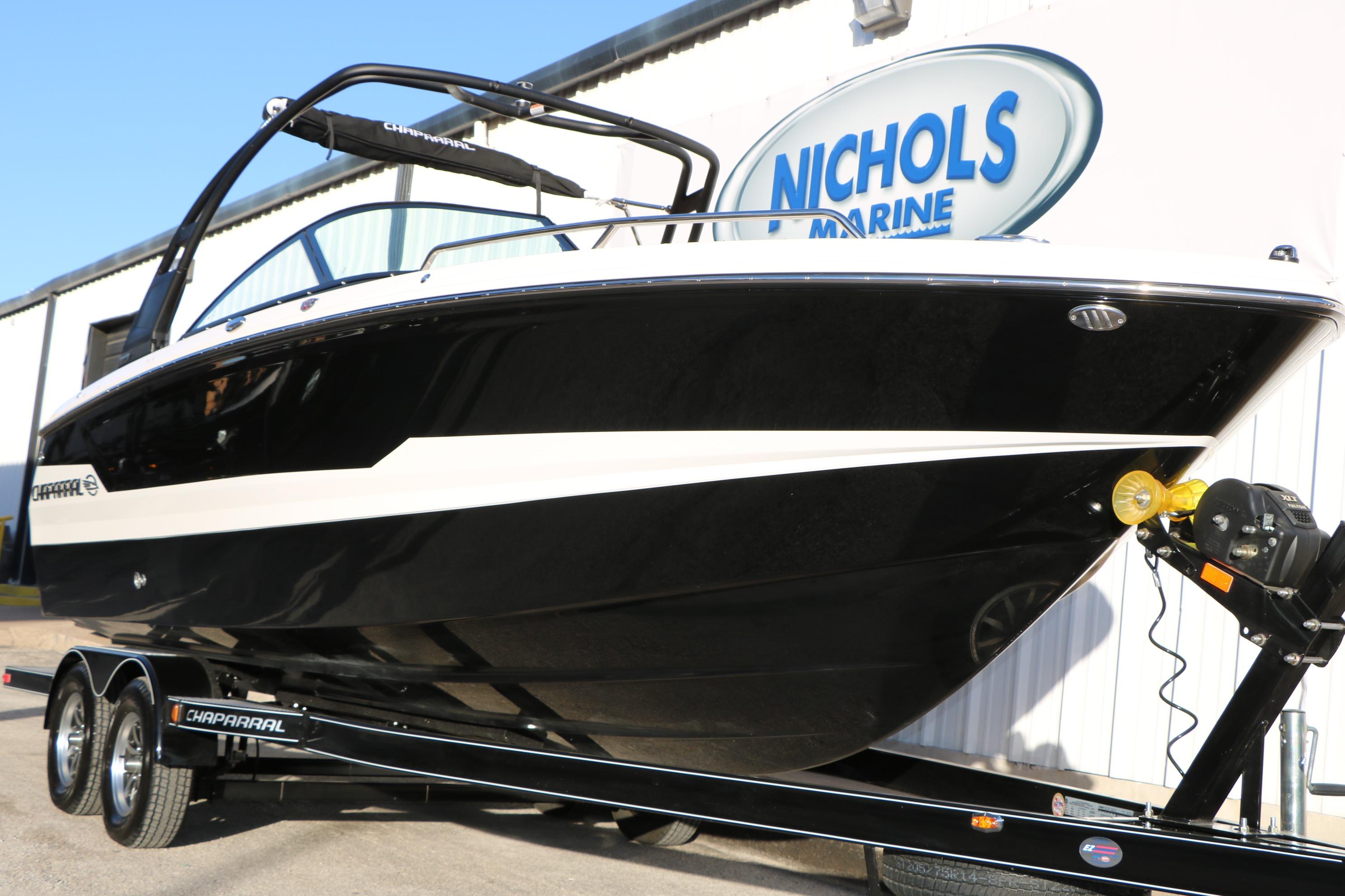 2026 Chaparral 247 SSX boat on trailer at Nichols Marine dealership.