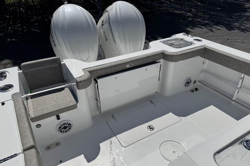 2026 Sea Hunt Gamefish 30 boat interior with dual Yamaha engines, forward seating.