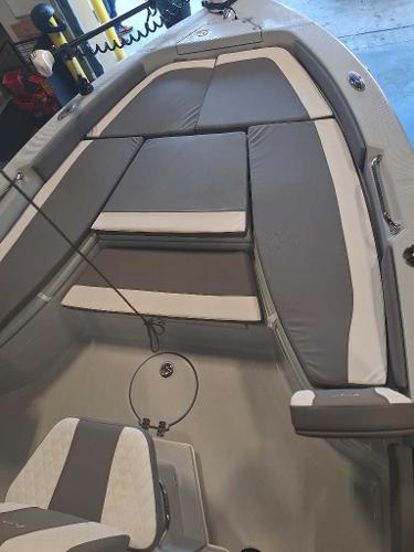 2025 Ranger 2660 Bay boat interior with gray and white cushioned seating.